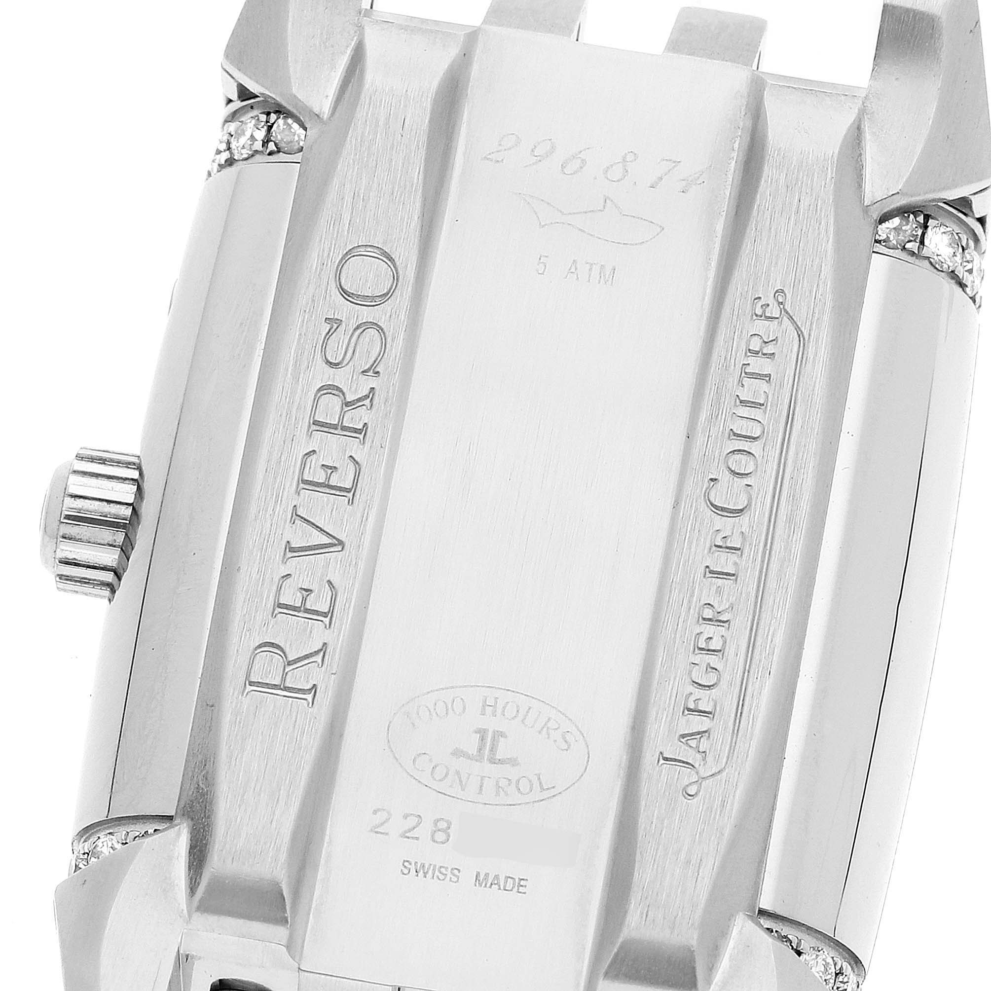 The image shows the back case of a Jaeger LeCoultre Reverso 296.8.74 Women's Stainless Steel Silver Dial 296.8.74 Women's Stainless Steel Silver Dial watch, highlighting the engraved text and crown.