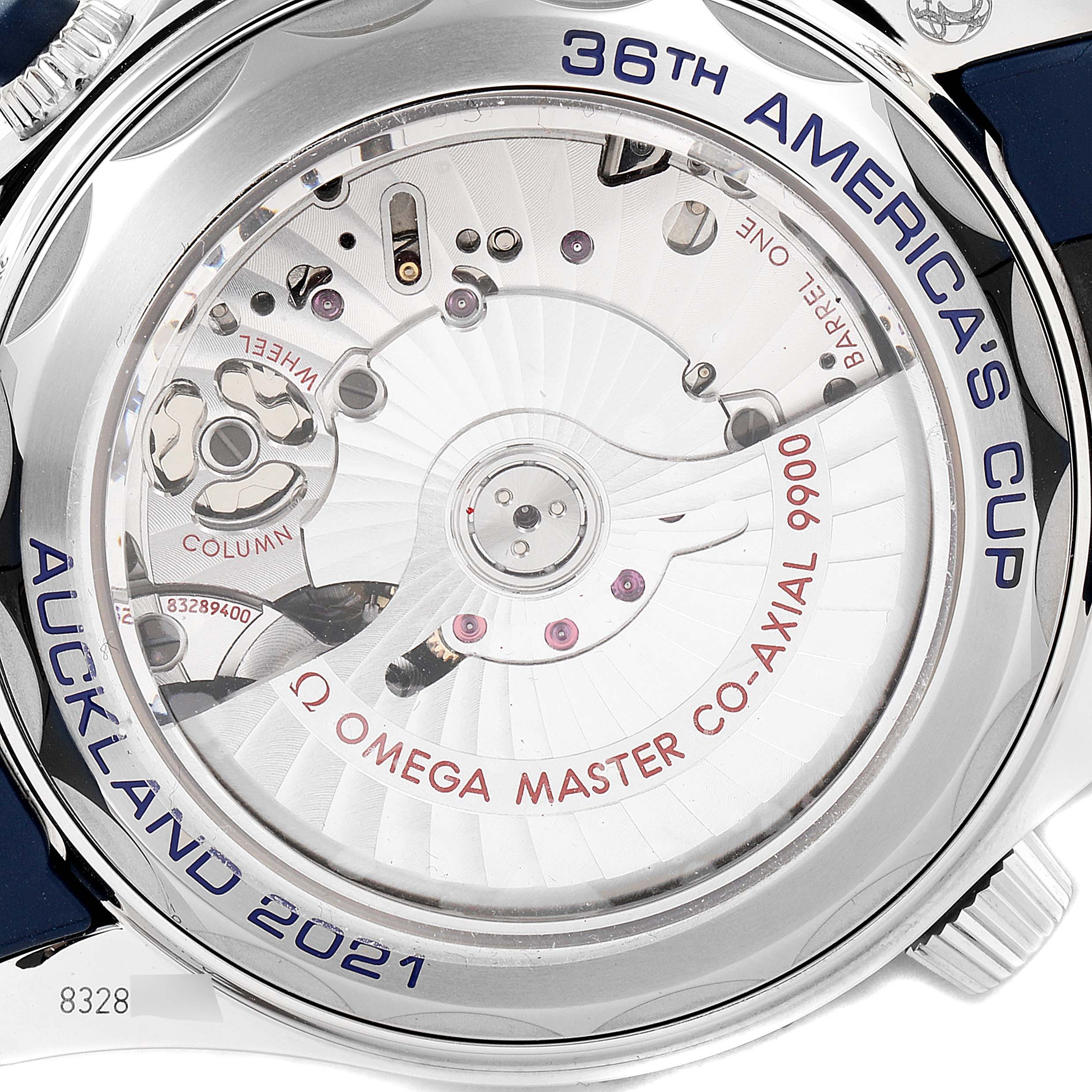 The image shows the back of an Omega Seamaster 210.30.44.51.03.002 Men's Stainless Steel Blue Dial 210.30.44.51.03.002 Men's Stainless Steel Blue Dial watch, highlighting its Omega Master Co-Axial 9900 movement and engravings for the 36th America's Cup.