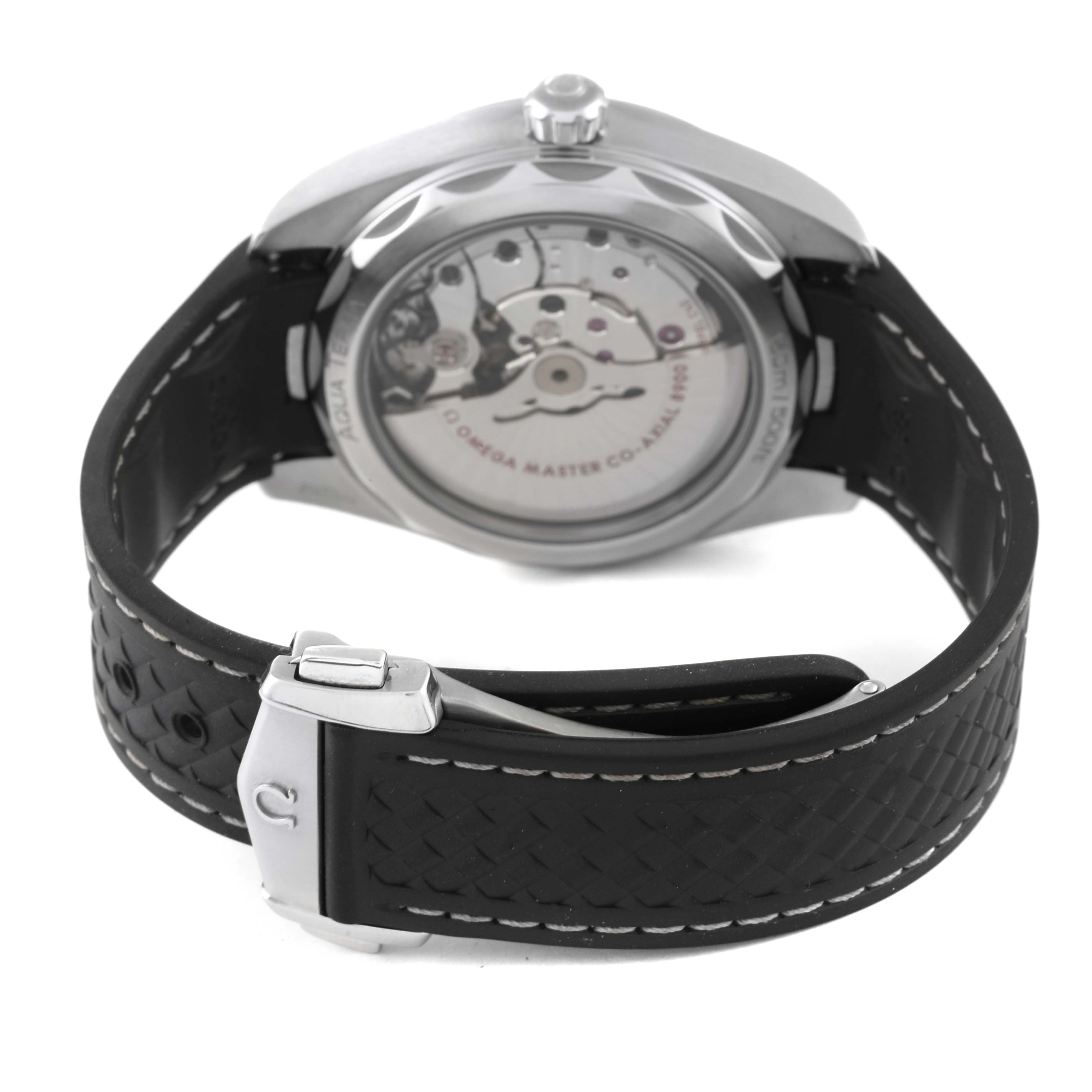 The Omega Aqua Terra 220.12.41.21.01.001 Men's Stainless Steel Black Dial 220.12.41.21.01.001 Men's Stainless Steel Black Dial watch is shown from the back, highlighting its transparent case back and black rubber strap with clasp.