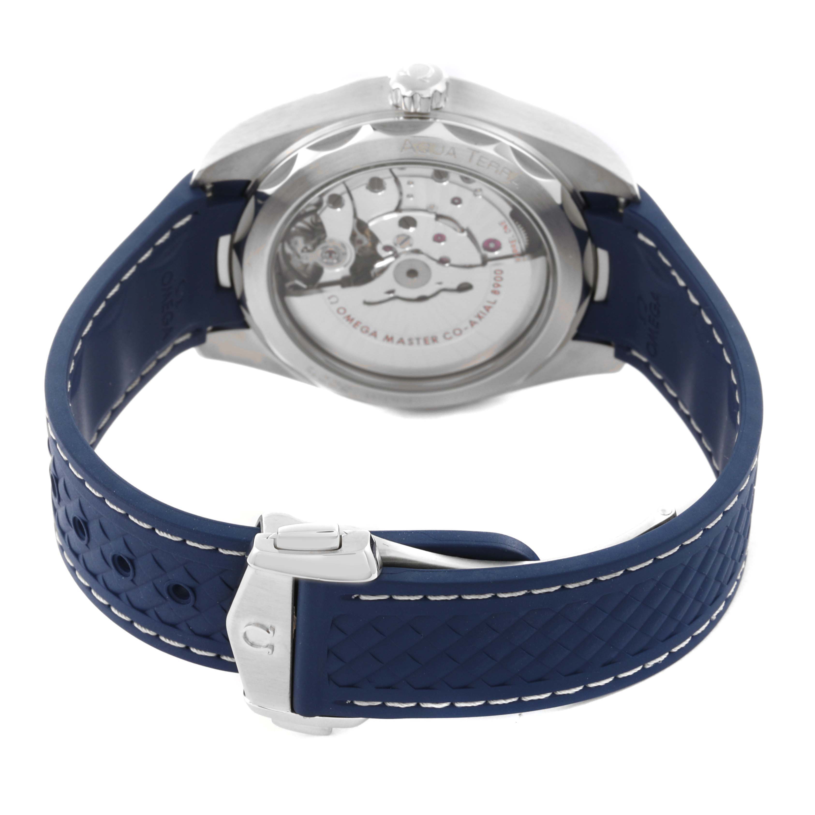 The Omega Aqua Terra 220.12.41.21.03.002 Men's Stainless Steel Blue Dial 220.12.41.21.03.002 Men's Stainless Steel Blue Dial watch is shown from the rear, highlighting the movement and a blue textured strap.