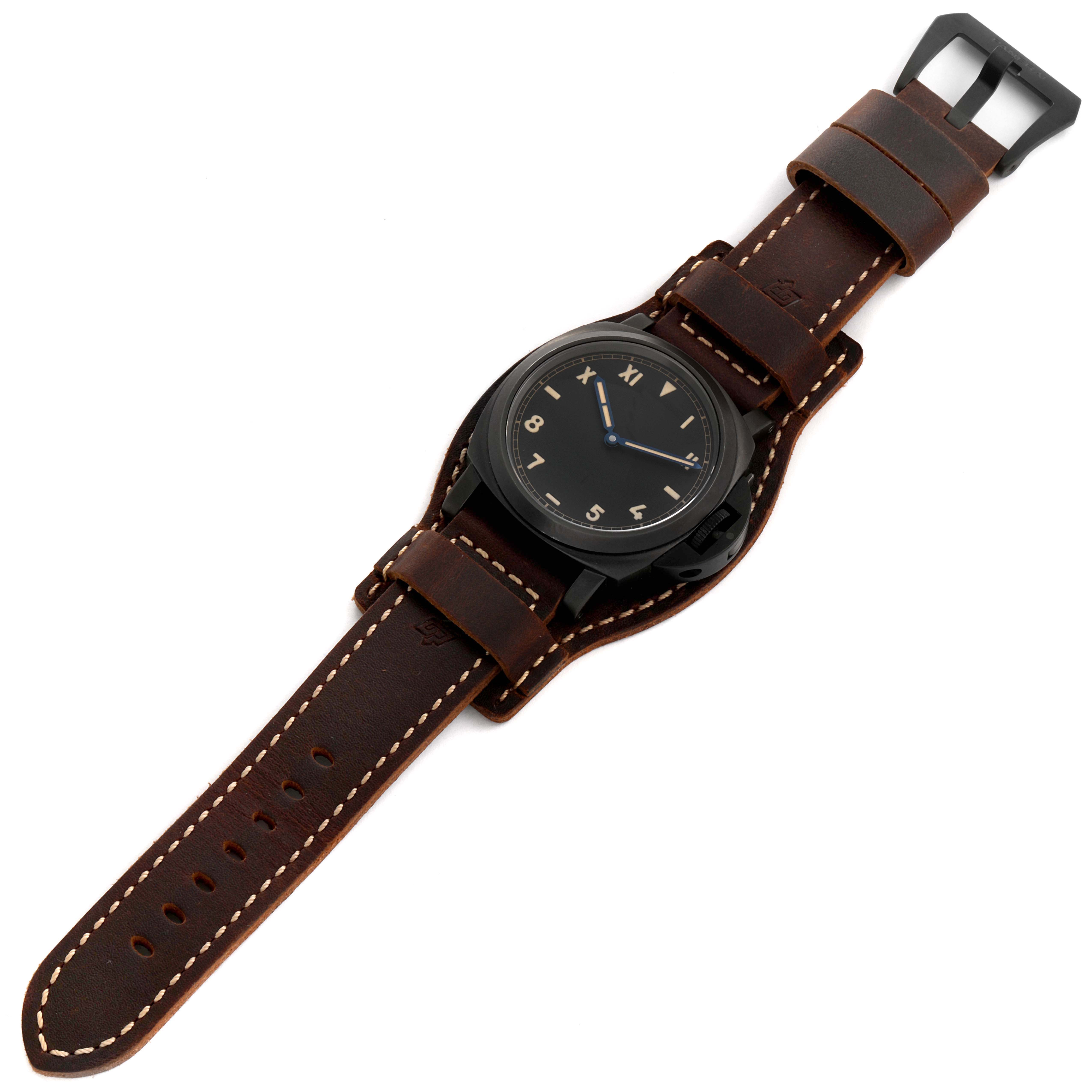 This image displays a Panerai Luminor PAM00779 Men's Titanium Black Dial PAM00779 Men's Titanium Black Dial watch from a top-down view, showcasing its leather strap and black dial.