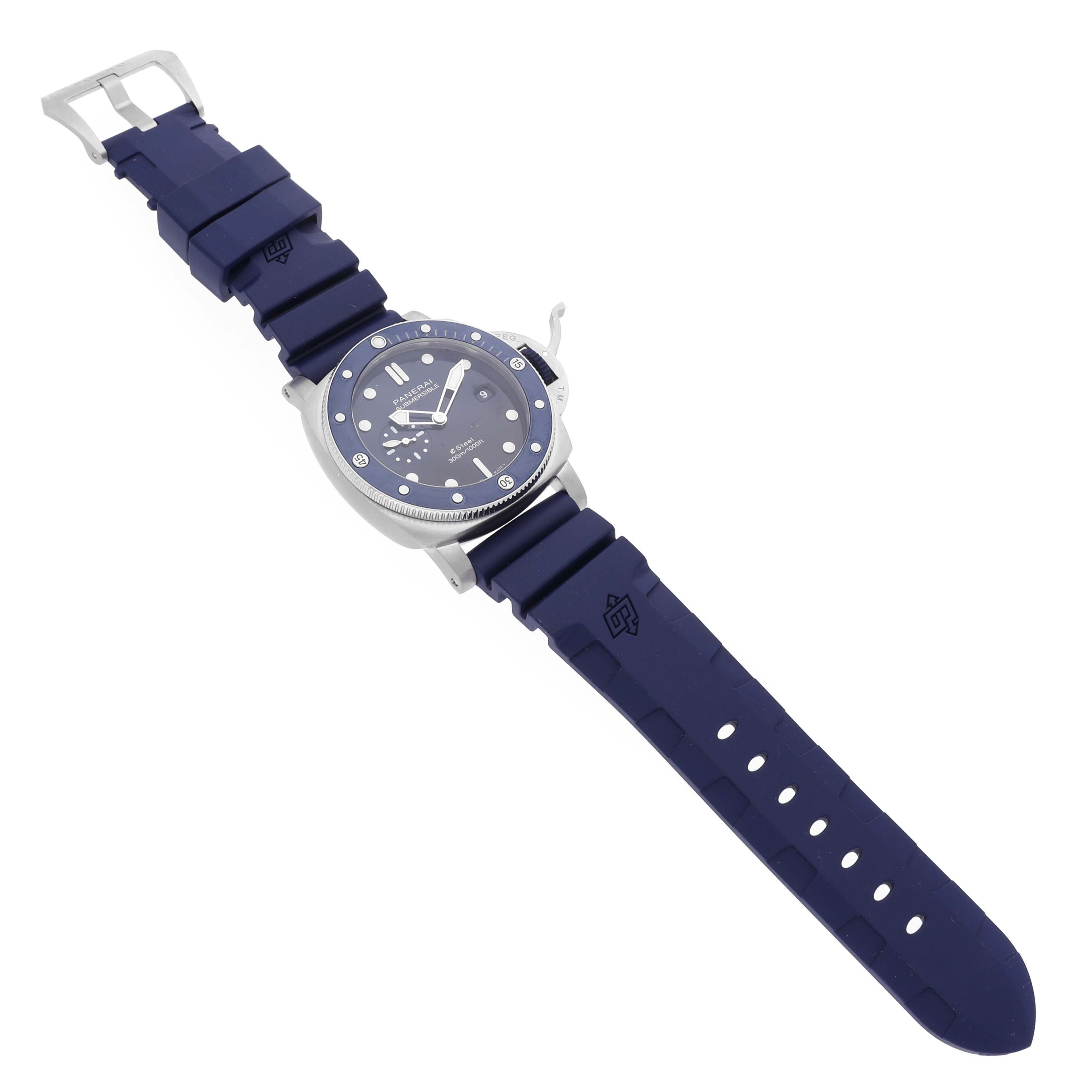 The Panerai Submersible PAM01289 Men's Stainless Steel Blue Dial PAM01289 Men's Stainless Steel Blue Dial watch is shown at a slightly angled top view, highlighting the dial, bezel, and blue rubber strap.