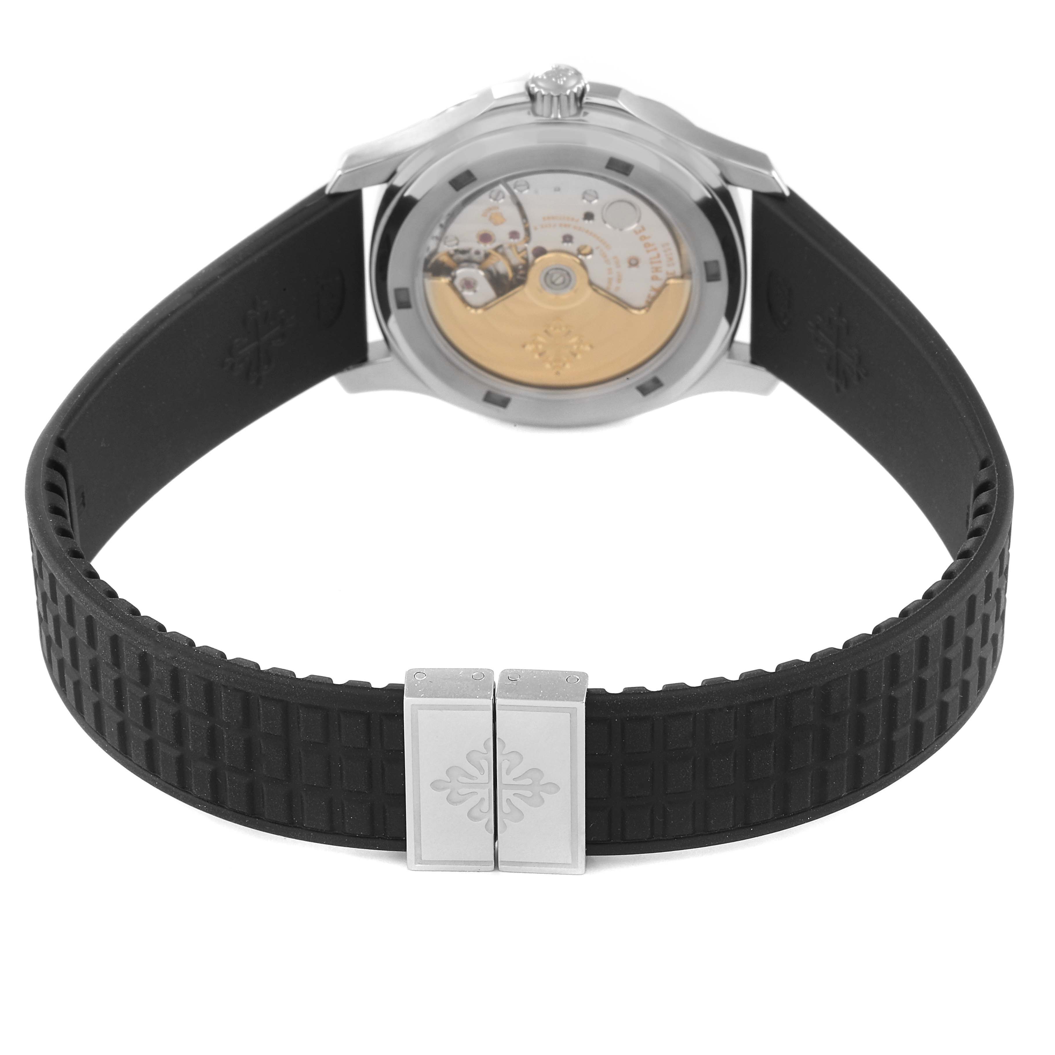 The image shows the back view of a Patek Philippe Aquanaut 5066A Men
s Stainless Steel Black Dial 5066A Men
s Stainless Steel Black Dial watch, highlighting its movement and black rubber strap.