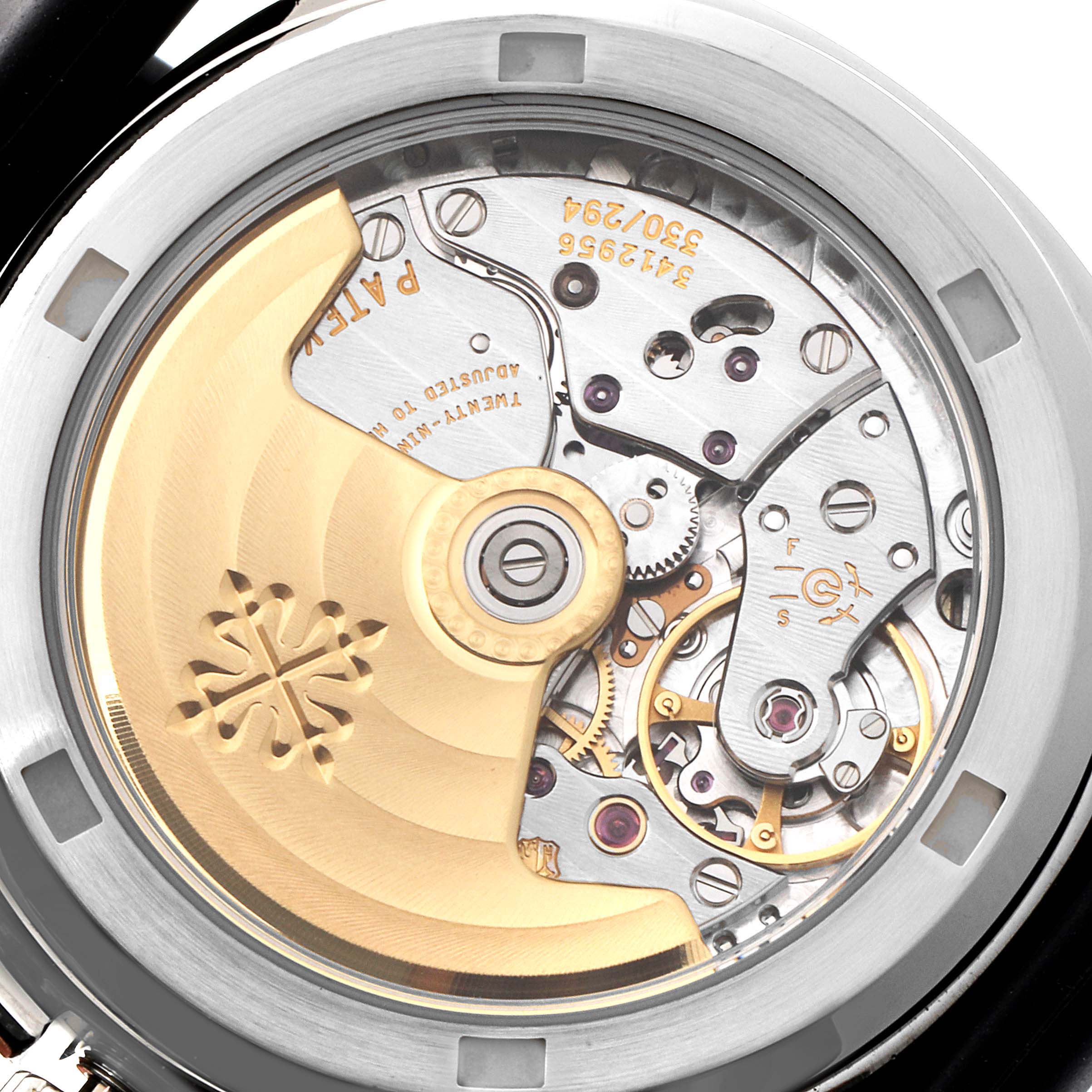 The image shows the case back of a Patek Philippe Aquanaut 5066A Men
s Stainless Steel Black Dial 5066A Men
s Stainless Steel Black Dial, displaying its intricate movement and rotor mechanism.