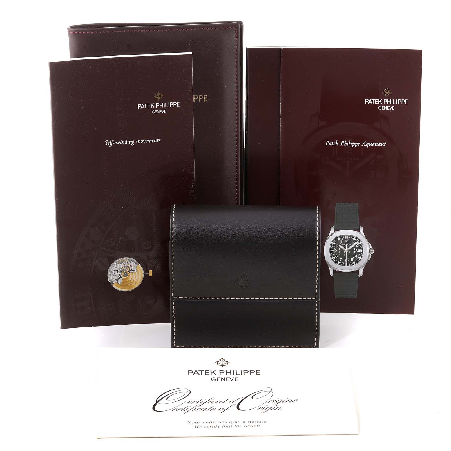 The image shows a Patek Philippe Aquanaut 5066A Men
s Stainless Steel Black Dial 5066A Men
s Stainless Steel Black Dial watch with accompanying booklets, leather case, and certificate, viewed from the front.