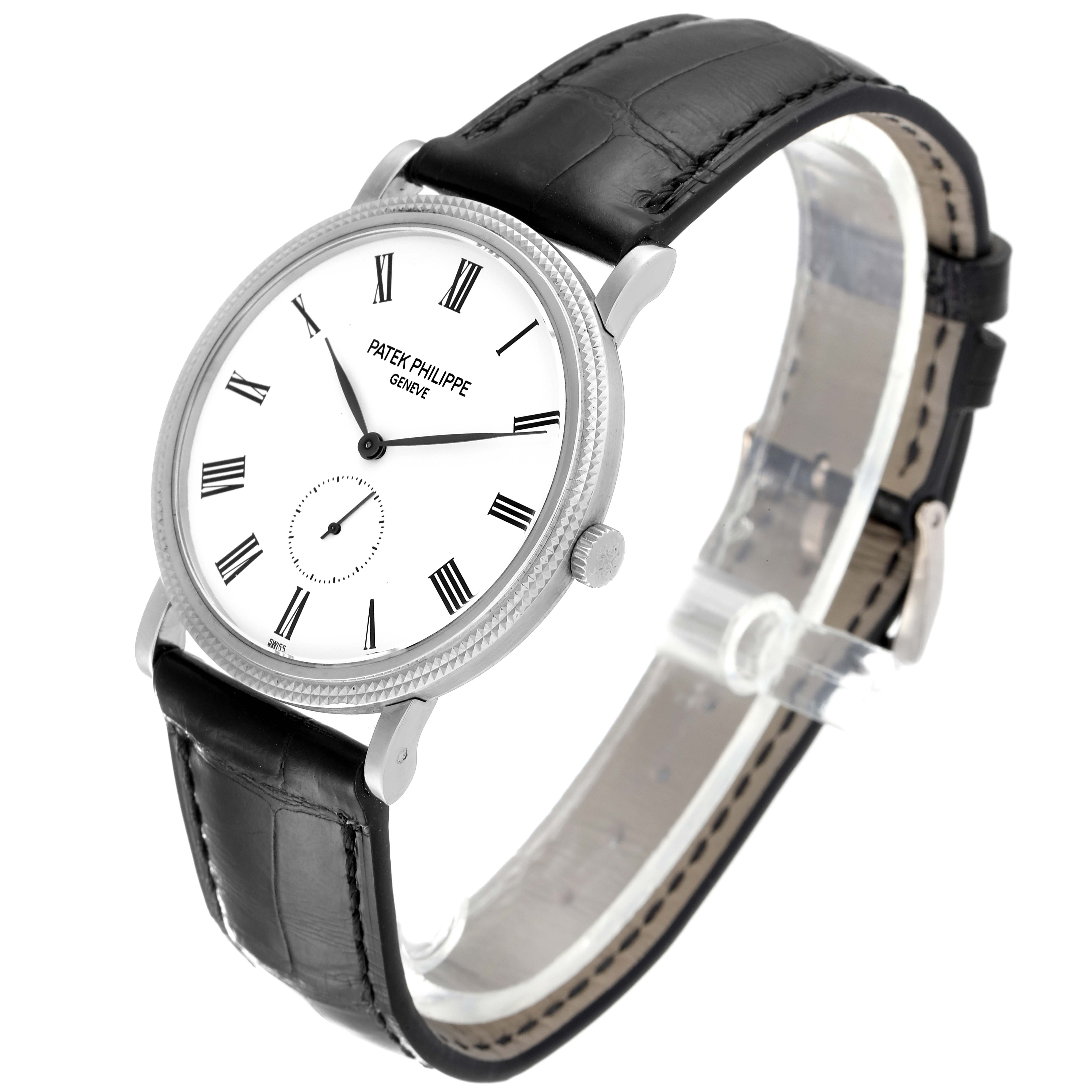This image shows a Patek Philippe Calatrava 5119G Men's White Gold White Dial 5119G Men's White Gold White Dial watch at an angled side view, featuring its dial, case, and leather strap.