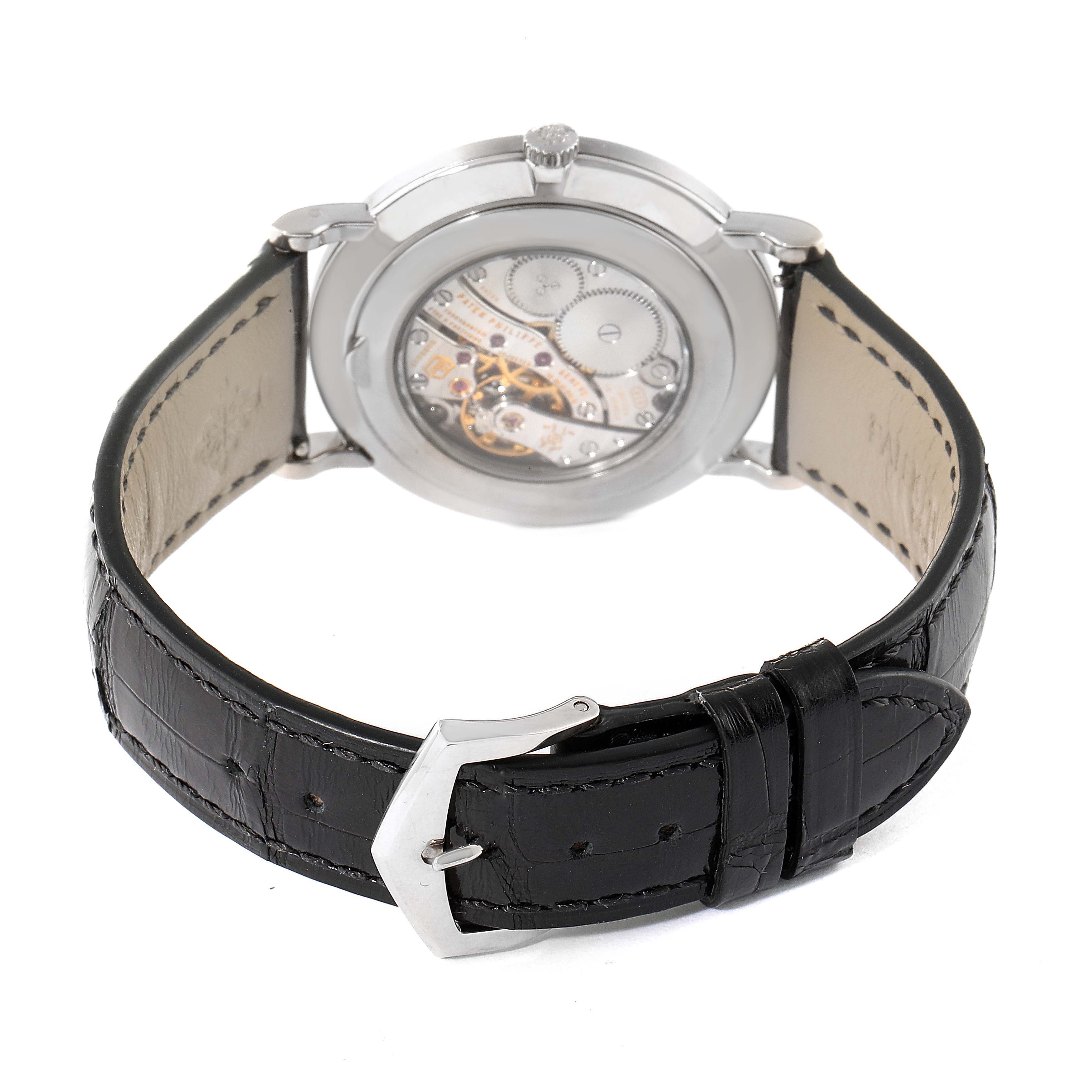 The image shows the back view of a Patek Philippe Calatrava 5119G Men's White Gold White Dial 5119G Men's White Gold White Dial watch with a leather strap and visible watch movement.