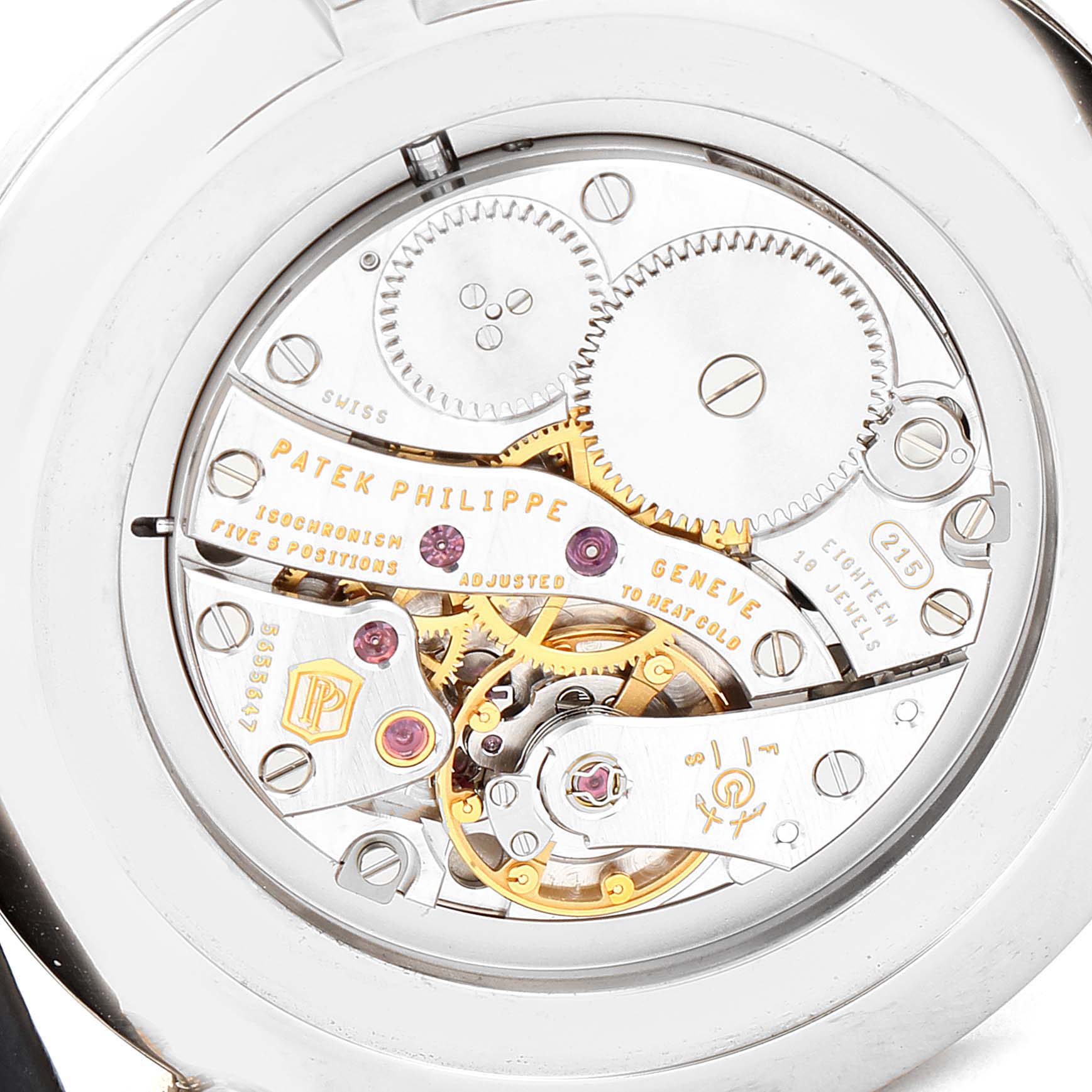 The image shows the intricate back view of a Patek Philippe Calatrava 5119G Men's White Gold White Dial 5119G Men's White Gold White Dial watch, revealing its mechanical movement and gears.