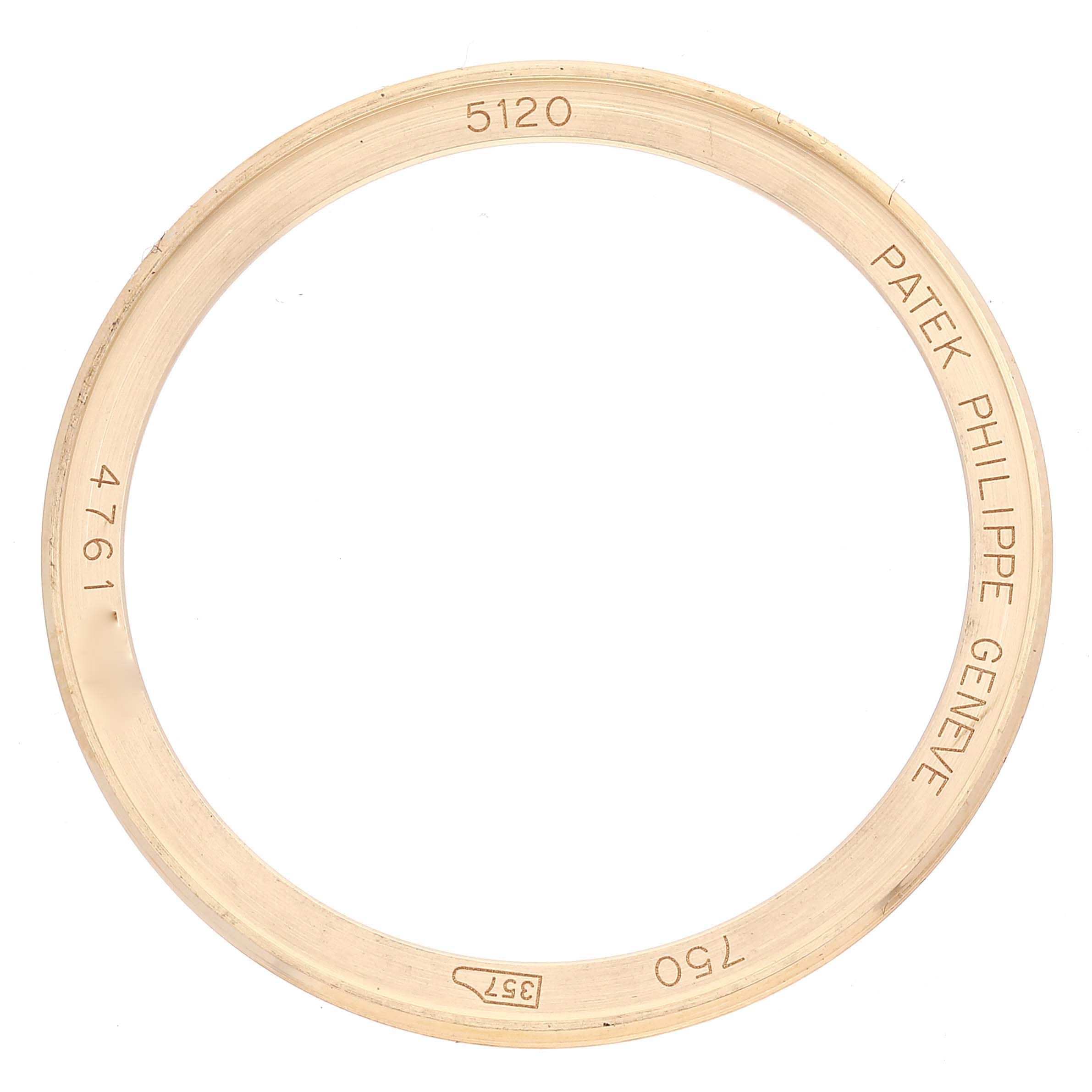 This image shows a Patek Philippe Calatrava 5120J Men's Yellow Gold White Dial 5120J Men's Yellow Gold White Dial 5120 model watch bezel from a top-down angle.