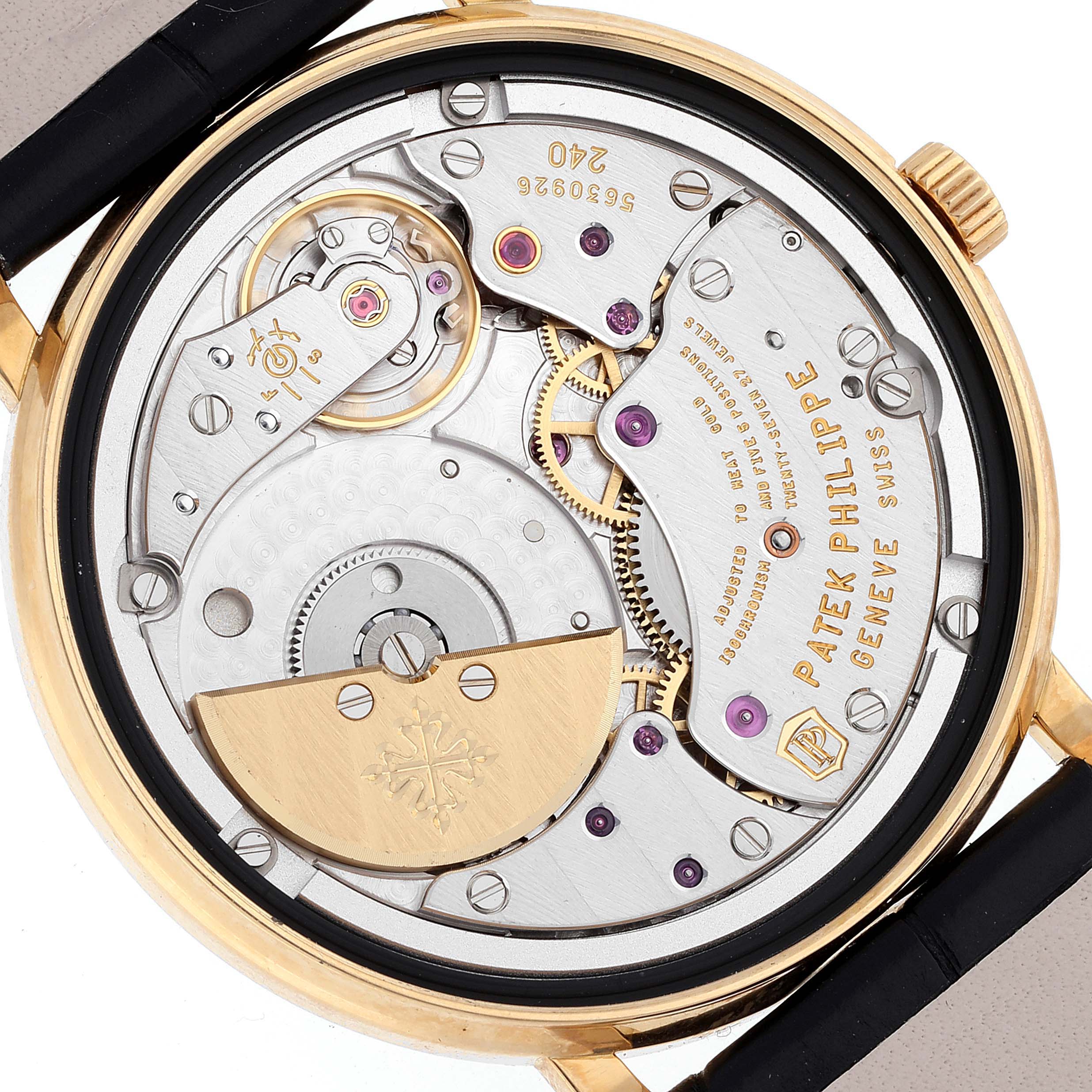 The image shows the back and internal mechanism of a Patek Philippe Calatrava 5120J Men's Yellow Gold White Dial 5120J Men's Yellow Gold White Dial watch.