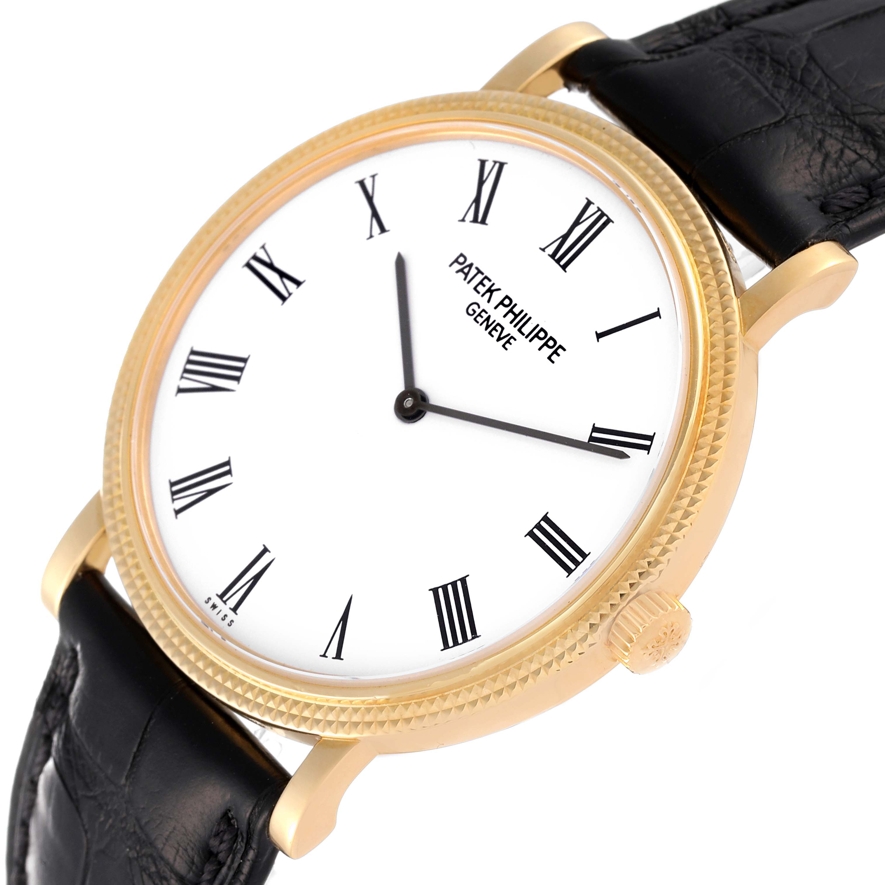 This image shows a Patek Philippe Calatrava 5120J Men's Yellow Gold White Dial 5120J Men's Yellow Gold White Dial watch from a slightly angled top view, highlighting the dial, crown, and part of the strap.