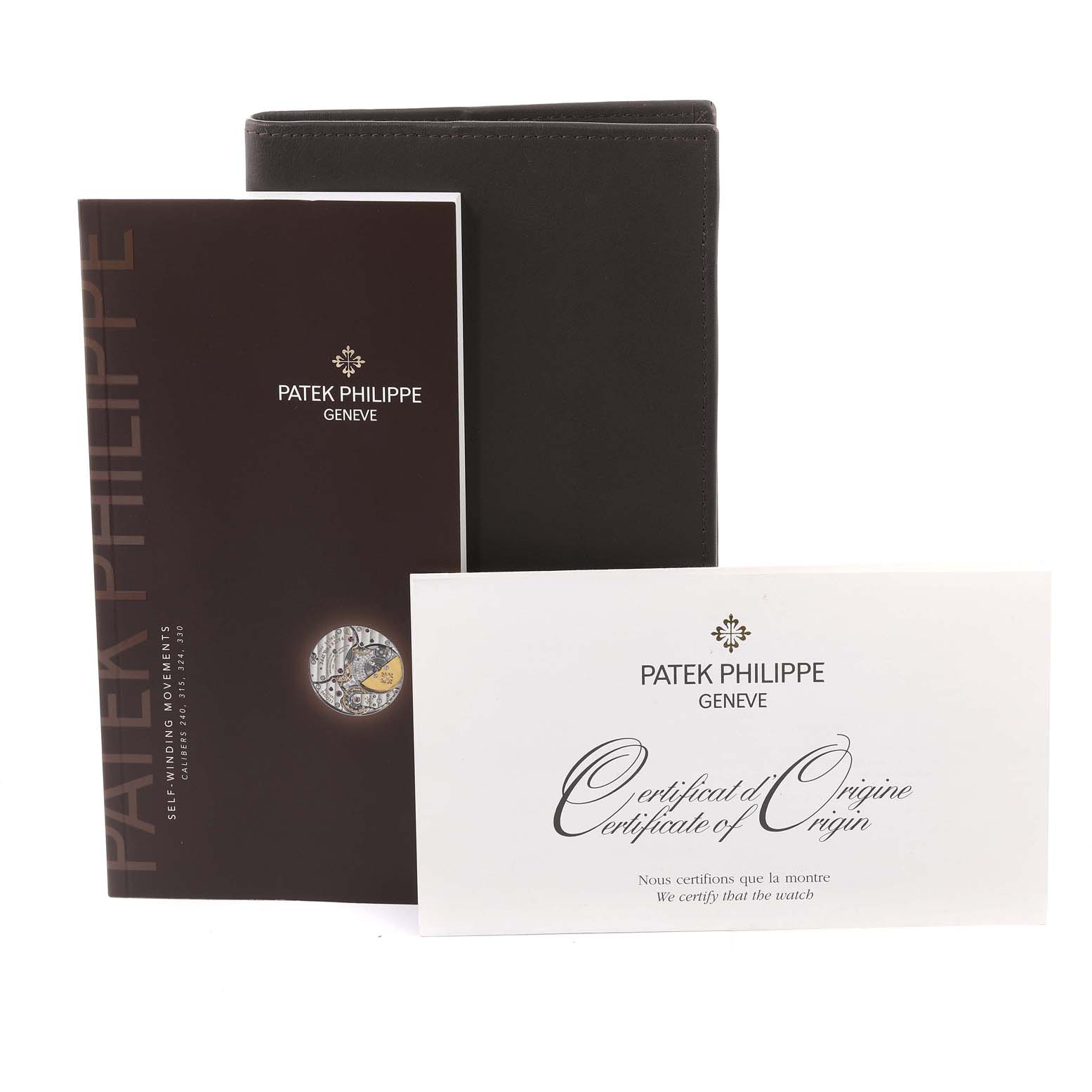 The image shows the documentation and certificate of origin for a Patek Philippe Calatrava 5120J Men's Yellow Gold White Dial 5120J Men's Yellow Gold White Dial watch.