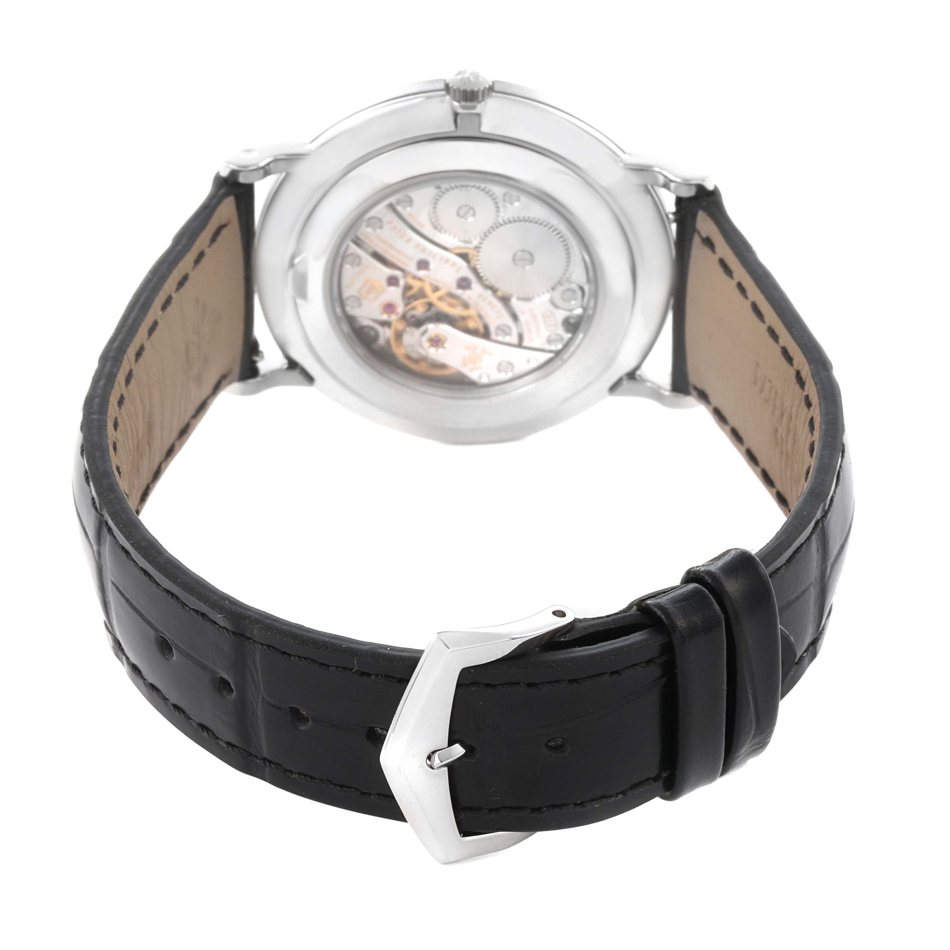The image shows the back view of the Patek Philippe Calatrava 5119G-001 Men
s White Gold White Dial 5119G-001 Men
s White Gold White Dial watch, highlighting the movement and leather strap.
