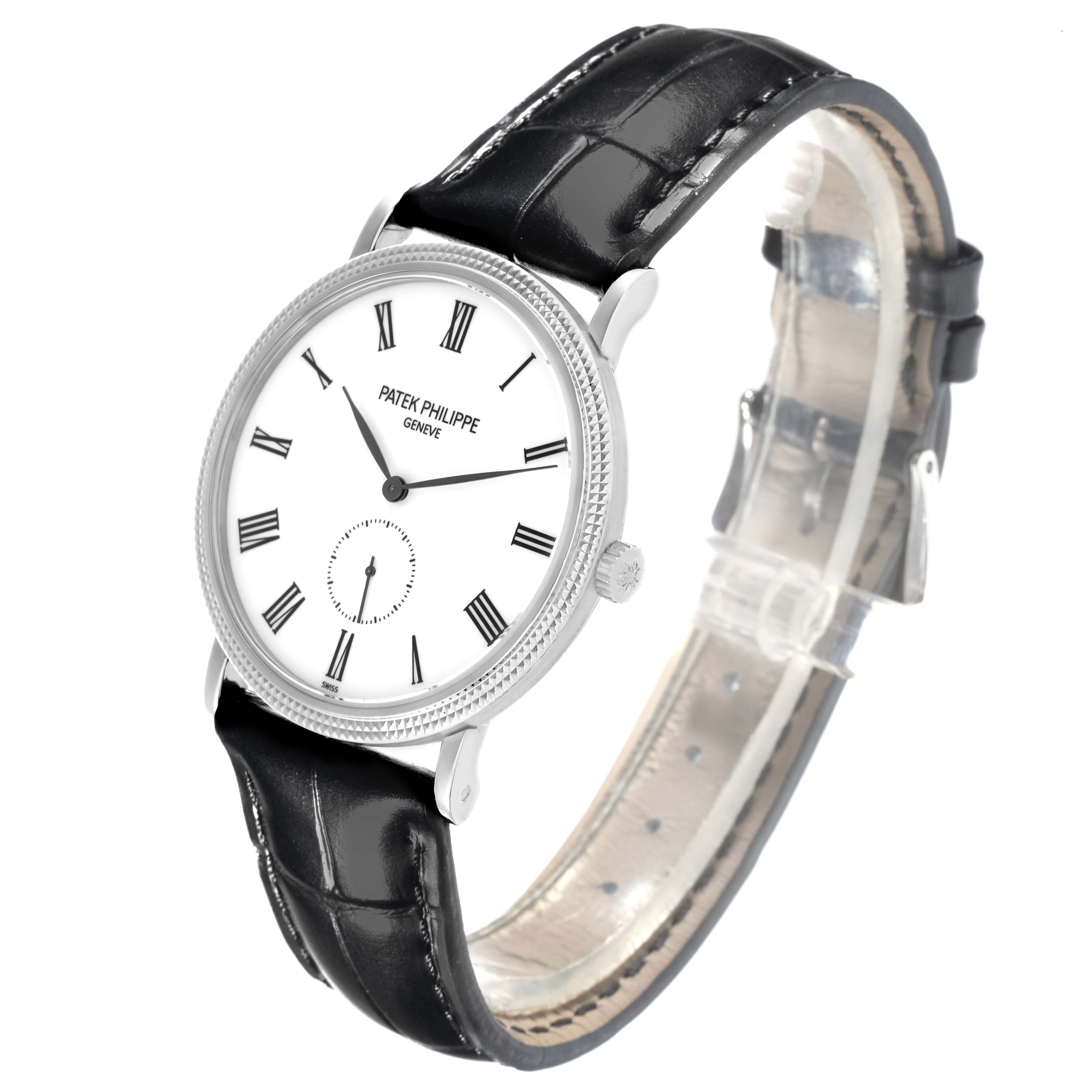 The Patek Philippe Calatrava 5119G-001 Men
s White Gold White Dial 5119G-001 Men
s White Gold White Dial watch is shown in a three-quarter view, displaying its dial, case, strap, and crown.