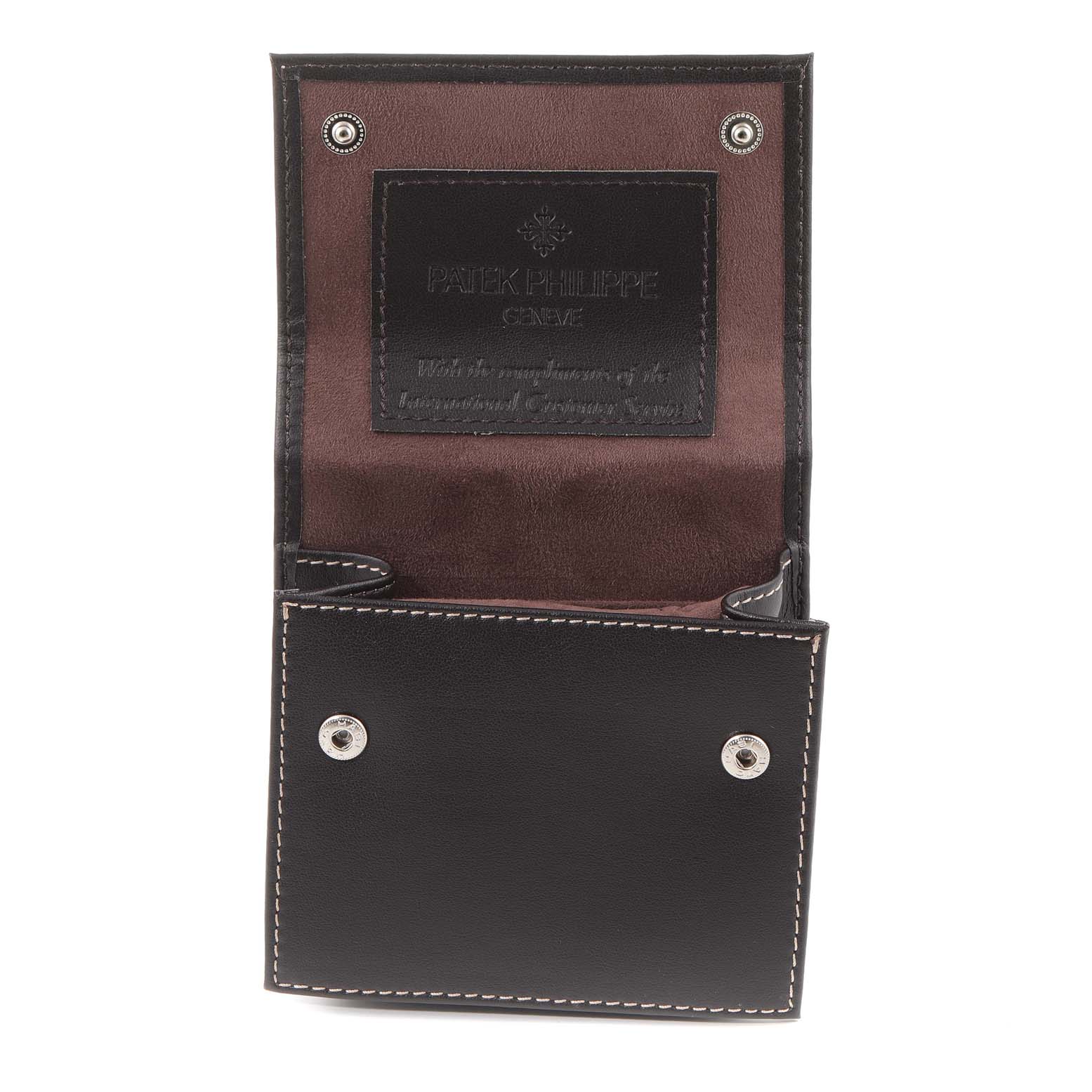 The image shows a black leather case for a Patek Philippe Calatrava 6000G Men's White Gold Grey Dial 6000G Men's White Gold Grey Dial watch, open to display its interior.