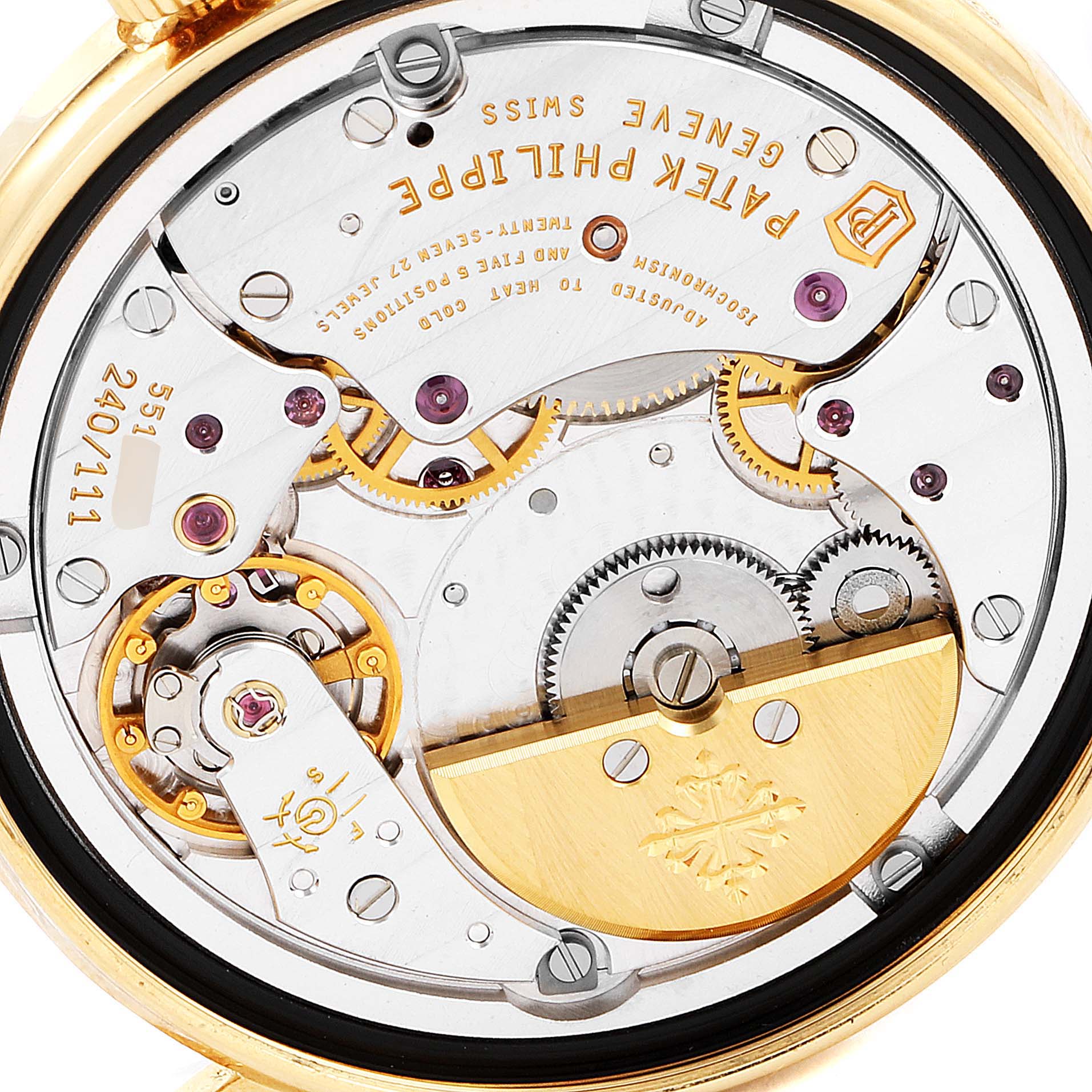 The image shows a close-up of the intricate internal mechanism of the Patek Philippe Calatrava 5120J Men
s Yellow Gold White Dial 5120J Men
s Yellow Gold White Dial watch from the backside.