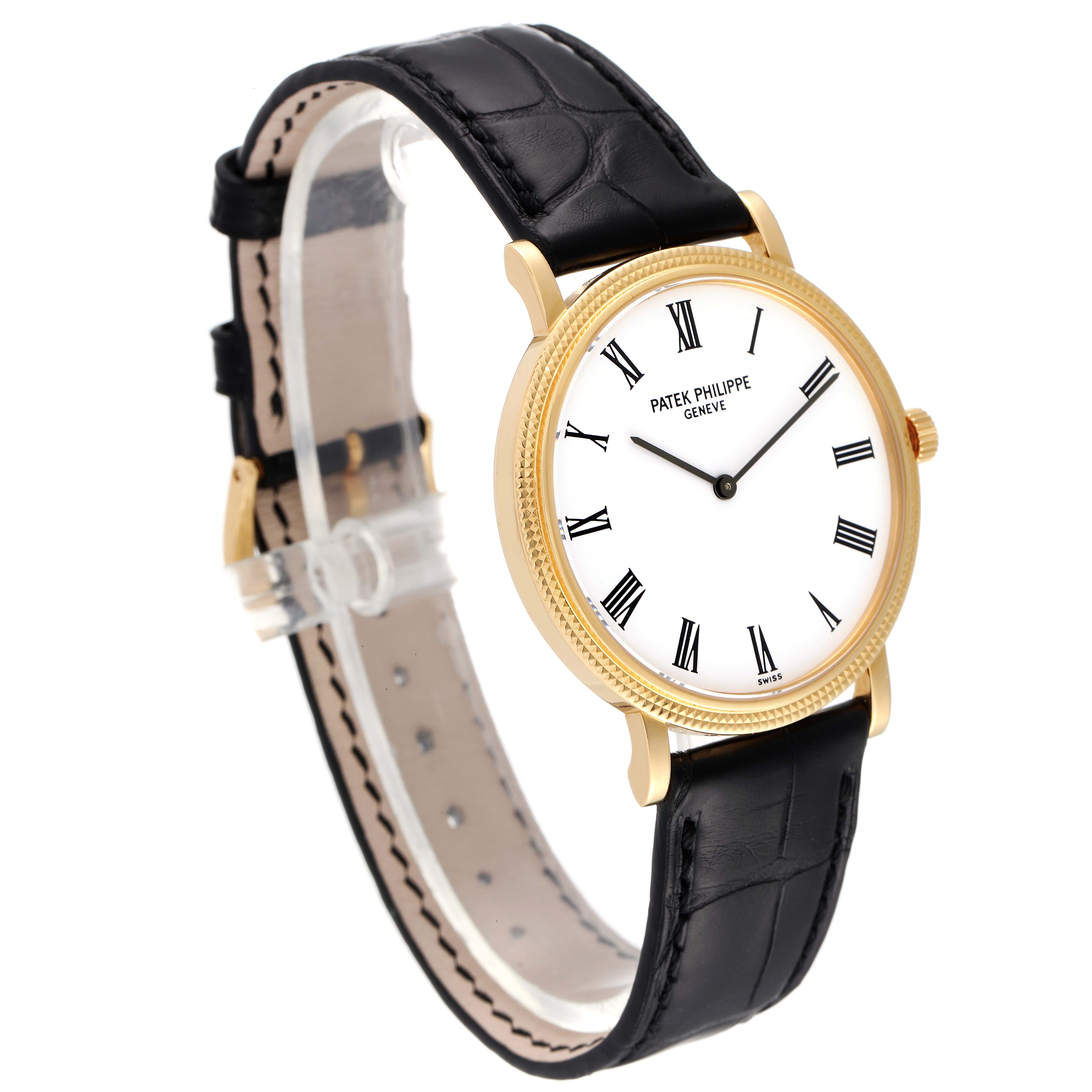 The image shows a Patek Philippe Calatrava 5120J Men
s Yellow Gold White Dial 5120J Men
s Yellow Gold White Dial watch at an angle displaying the face, black leather band, and side profile.