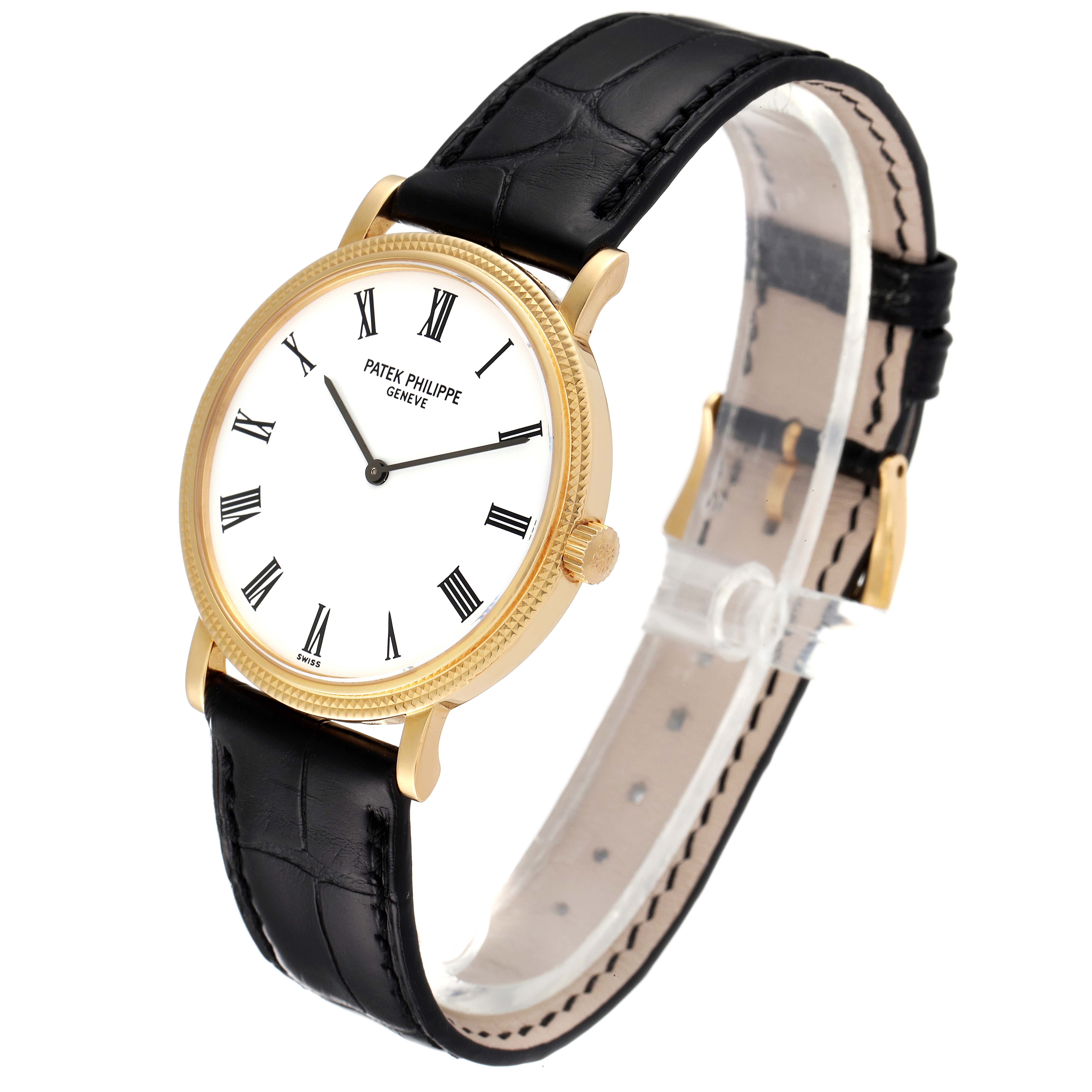 The image shows a Patek Philippe Calatrava 5120J Men
s Yellow Gold White Dial 5120J Men
s Yellow Gold White Dial watch with a side view, displaying the dial, bezel, crown, and leather strap.