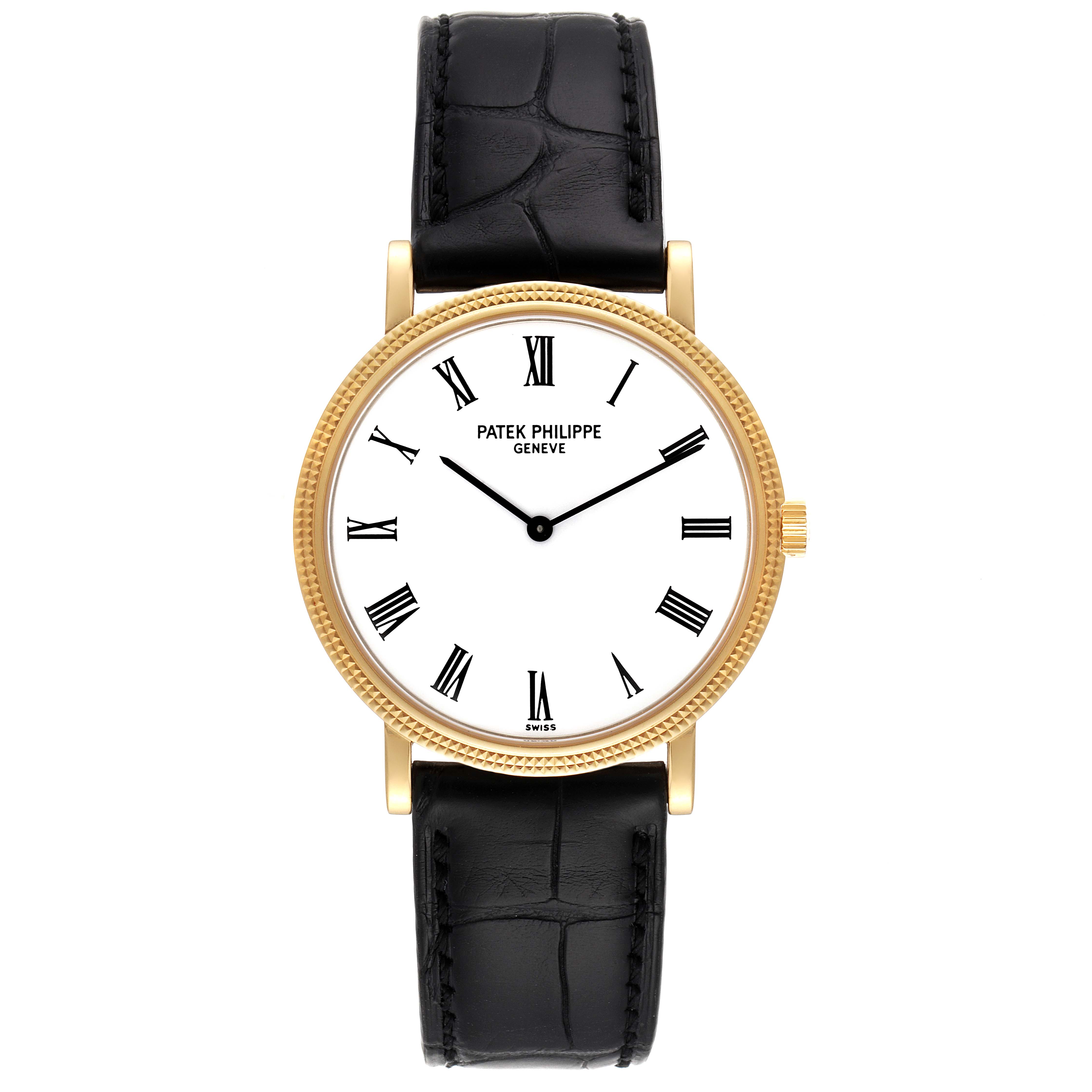 The image shows the front view of a Patek Philippe Calatrava 5120J Men
s Yellow Gold White Dial 5120J Men
s Yellow Gold White Dial watch with a gold case and black leather strap.