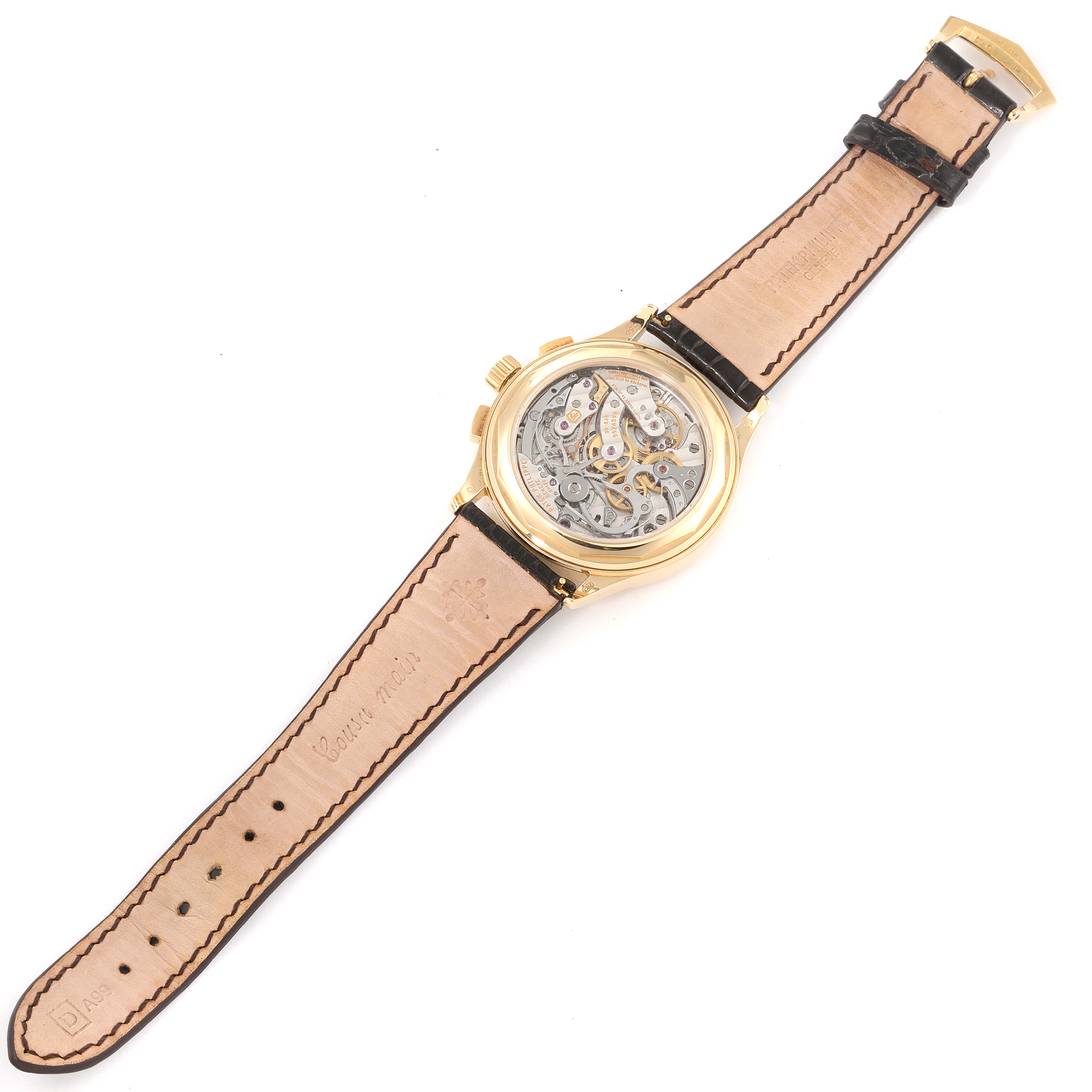 The image shows the back view of the Patek Philippe Complications 5170J Men's Yellow Gold Silver Dial 5170J Men's Yellow Gold Silver Dial watch, revealing its intricate movement and leather strap.