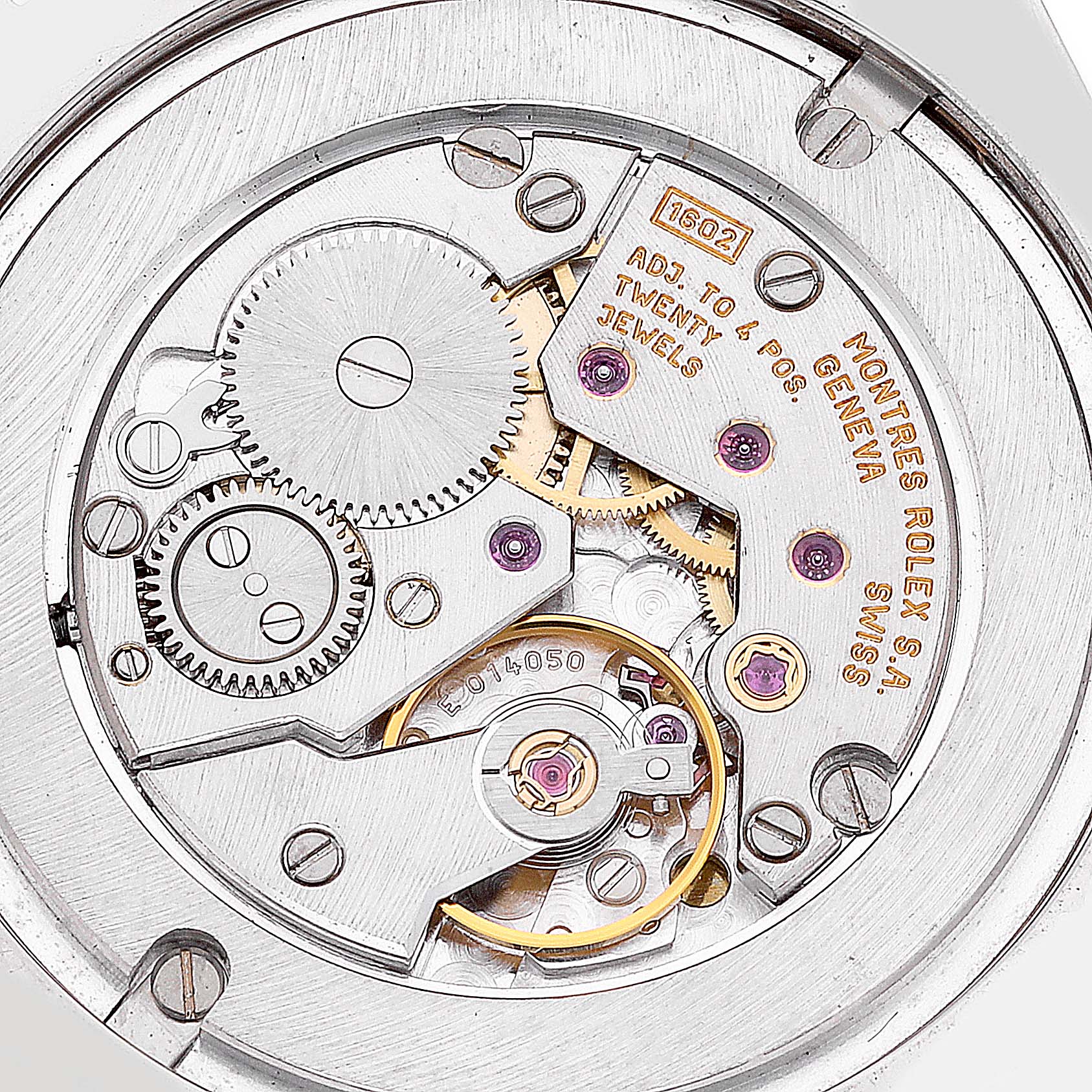 This close-up image of a Rolex Cellini 4233 Men's Steel and Gold (two tone) Black Dial 4233 Men's Steel and Gold (two tone) Black Dial model shows its intricate internal movement, gears, and jewels.