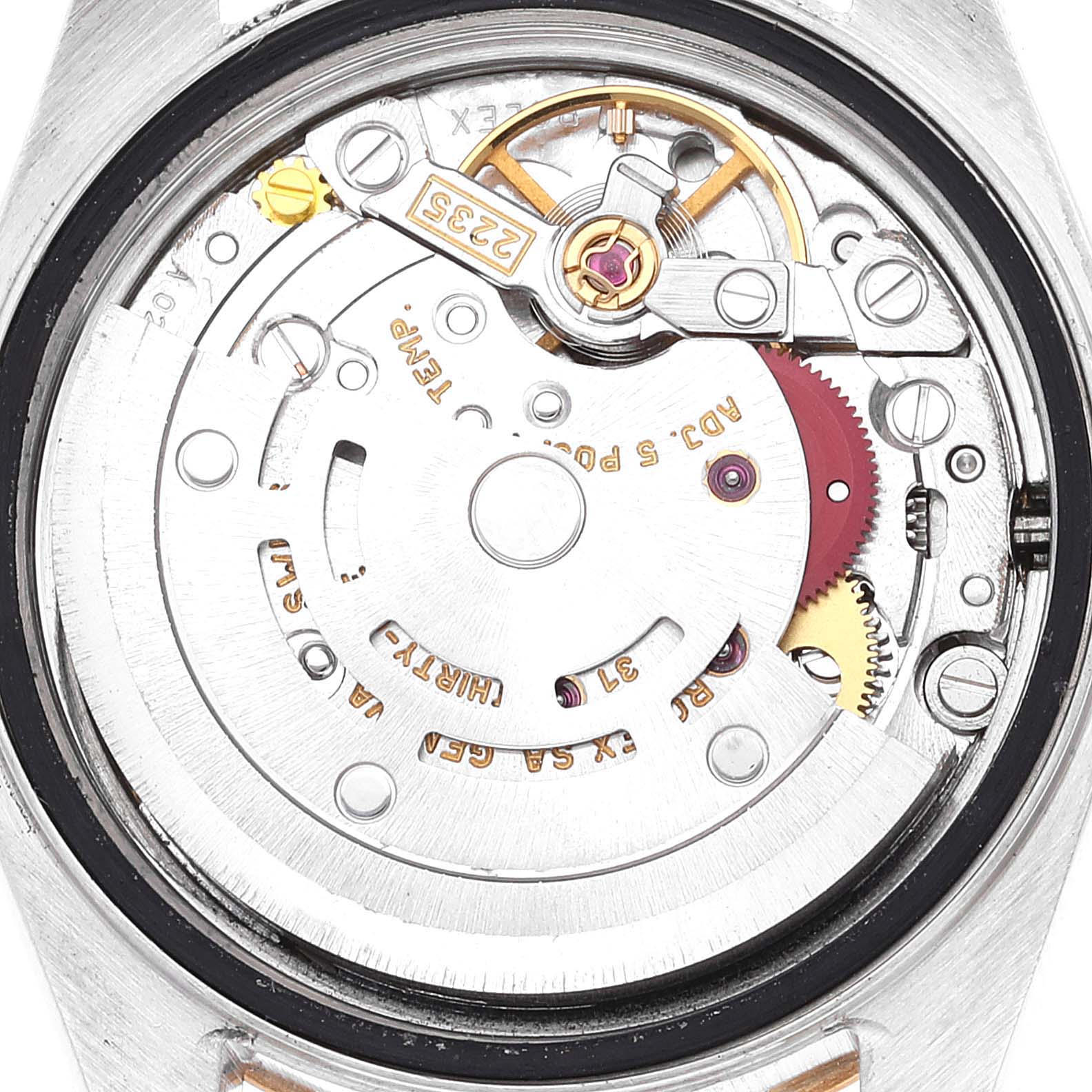 The image shows a close-up of the movement and inner workings of a Rolex Datejust 79173 Women's Steel and Gold (two tone) White Dial 79173 Women's Steel and Gold (two tone) White Dial watch from the back.