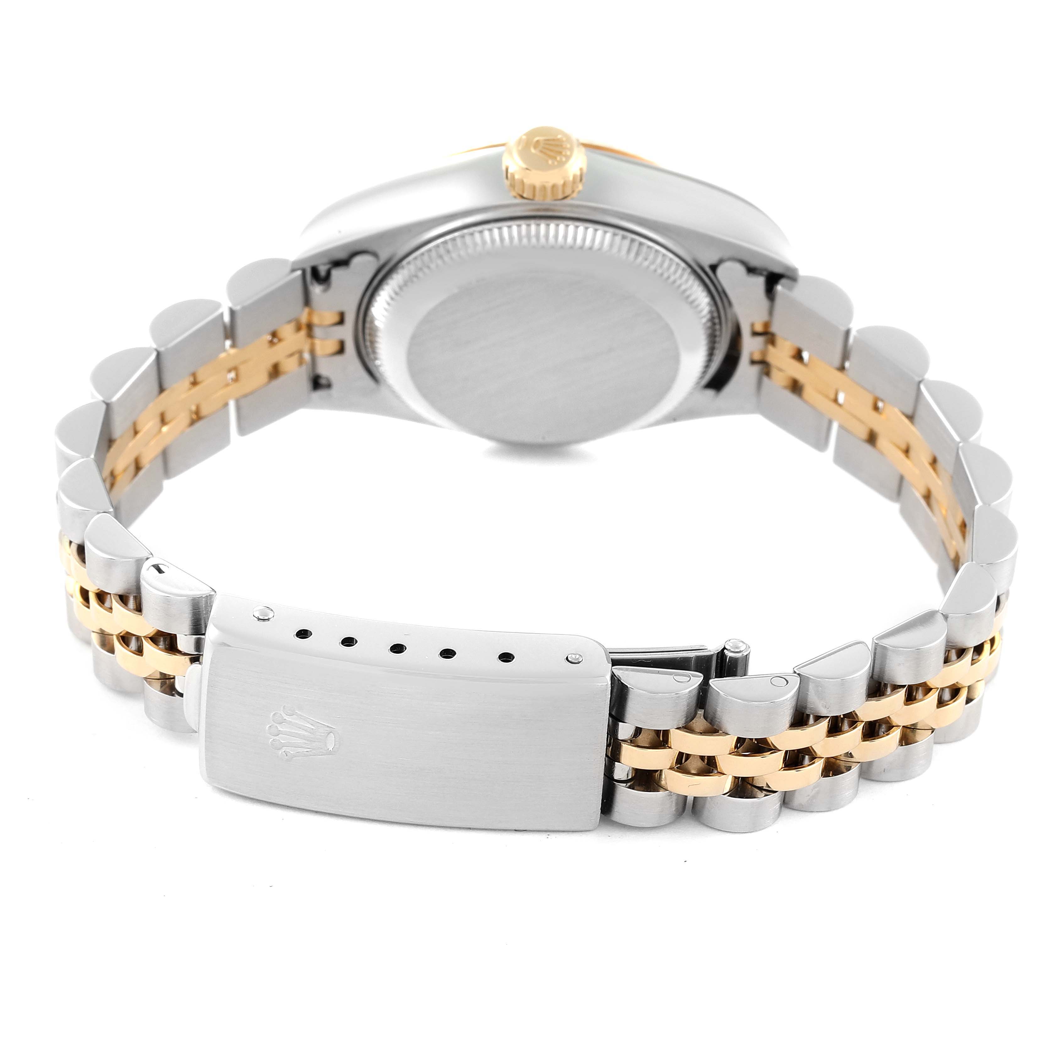 The image shows the back view of a Rolex Datejust 79173 Women's Steel and Gold (two tone) White Dial 79173 Women's Steel and Gold (two tone) White Dial watch focusing on the caseback, crown, and bicolored bracelet.