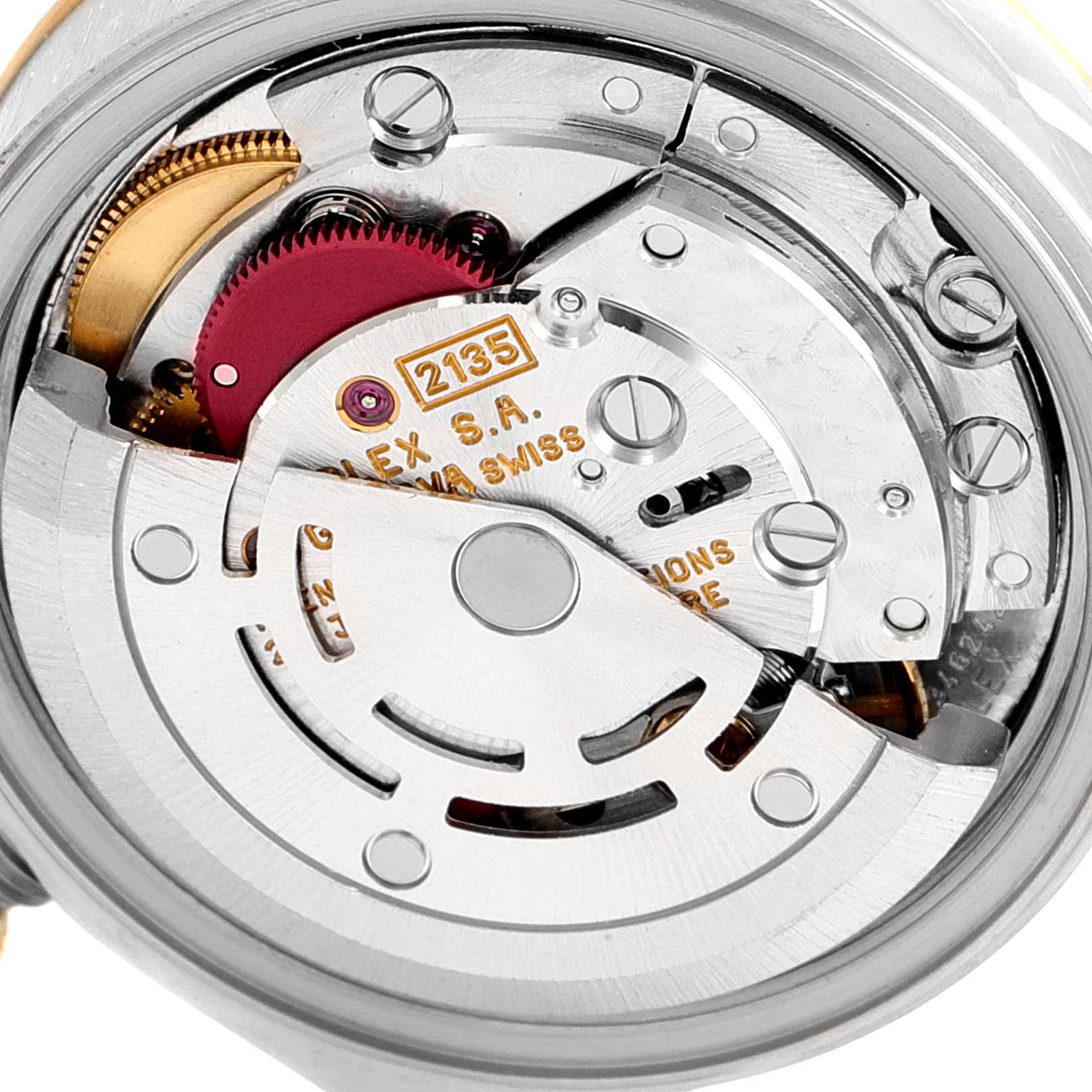 The image shows an angled close-up of the movement mechanism of a Rolex Datejust 69173 Women
s Steel and Gold (two tone) Champagne Dial 69173 Women
s Steel and Gold (two tone) Champagne Dial watch.