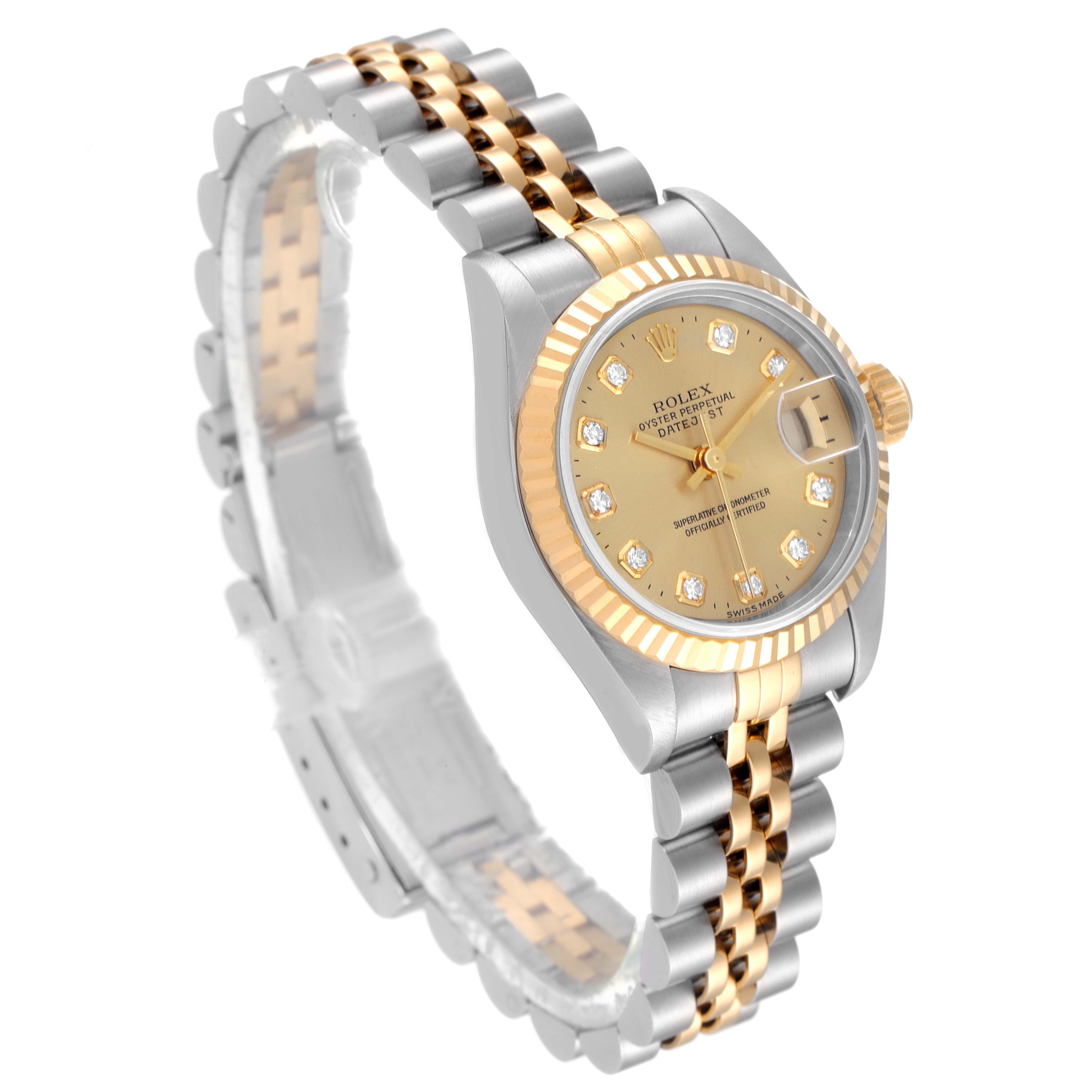 This image shows a Rolex Datejust 69173 Women
s Steel and Gold (two tone) Champagne Dial 69173 Women
s Steel and Gold (two tone) Champagne Dial watch at a three-quarter angle, highlighting its two-tone bracelet, fluted bezel, and champagne dial.