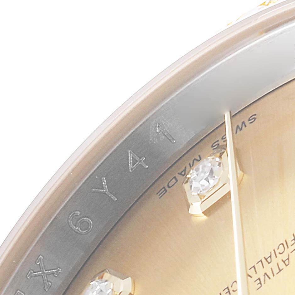 This image shows a close-up of the dial
s edge and diamond hour markers of a Rolex Datejust 116243 Men
s Steel and Gold (two tone) Champagne Dial 116243 Men
s Steel and Gold (two tone) Champagne Dial watch.