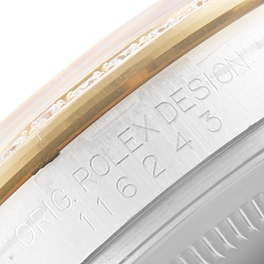 This image shows the side view of the bezel and serial number engraving on a Rolex Datejust 116243 Men
s Steel and Gold (two tone) Champagne Dial 116243 Men
s Steel and Gold (two tone) Champagne Dial watch.