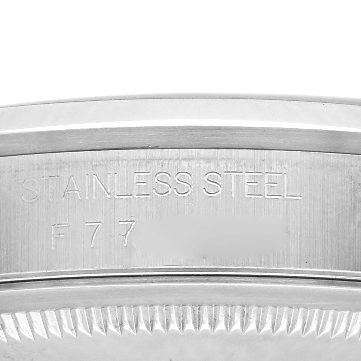 The image shows the side view of the watch case of a Rolex Datejust 16200 Men
s Stainless Steel Black Dial 16200 Men
s Stainless Steel Black Dial, focusing on the stainless steel engraving.