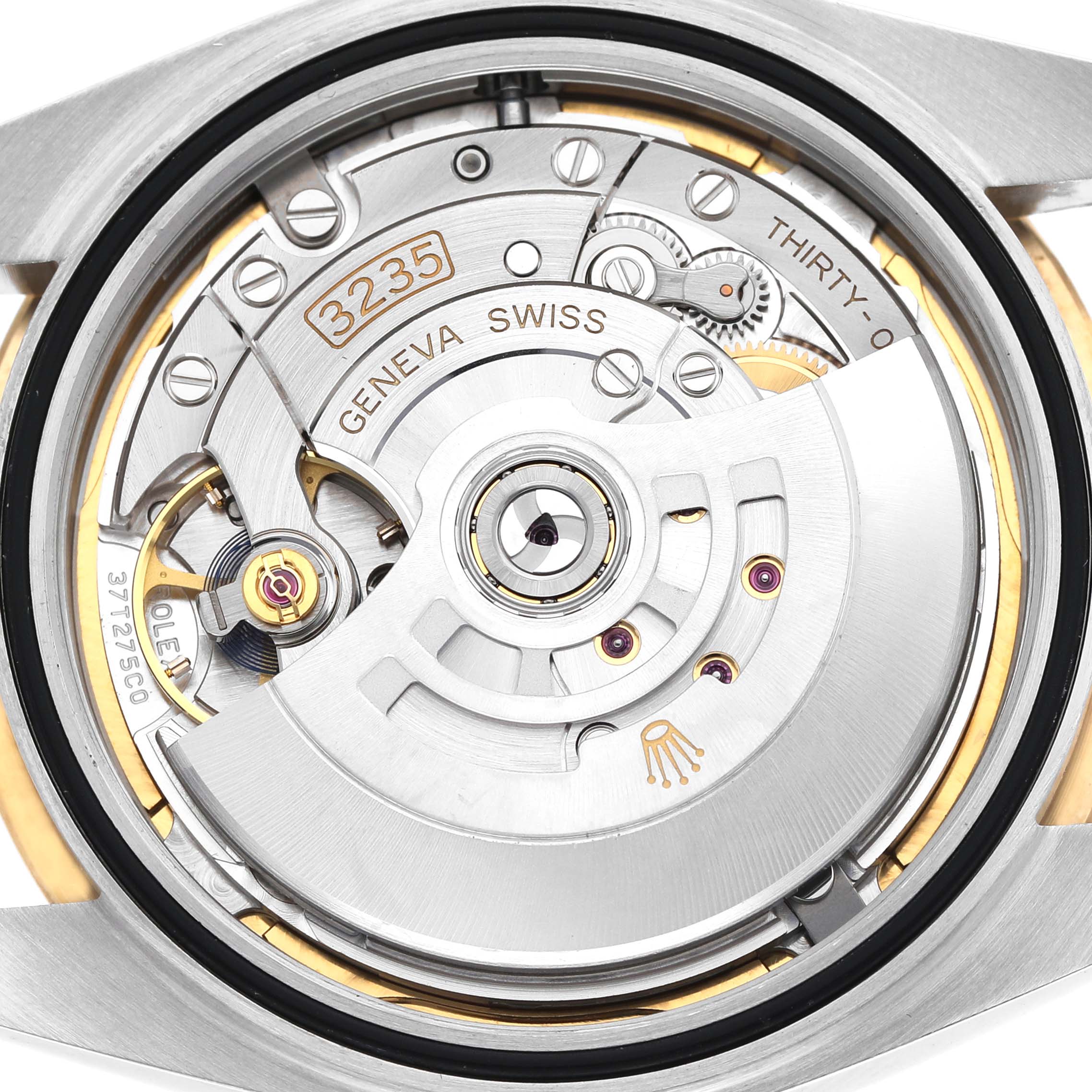 This image shows the movement of the Rolex Datejust 41 126333 Men's Steel and Gold (two tone) Silver Dial, focusing on the intricate mechanics and rotor from a rear angle.