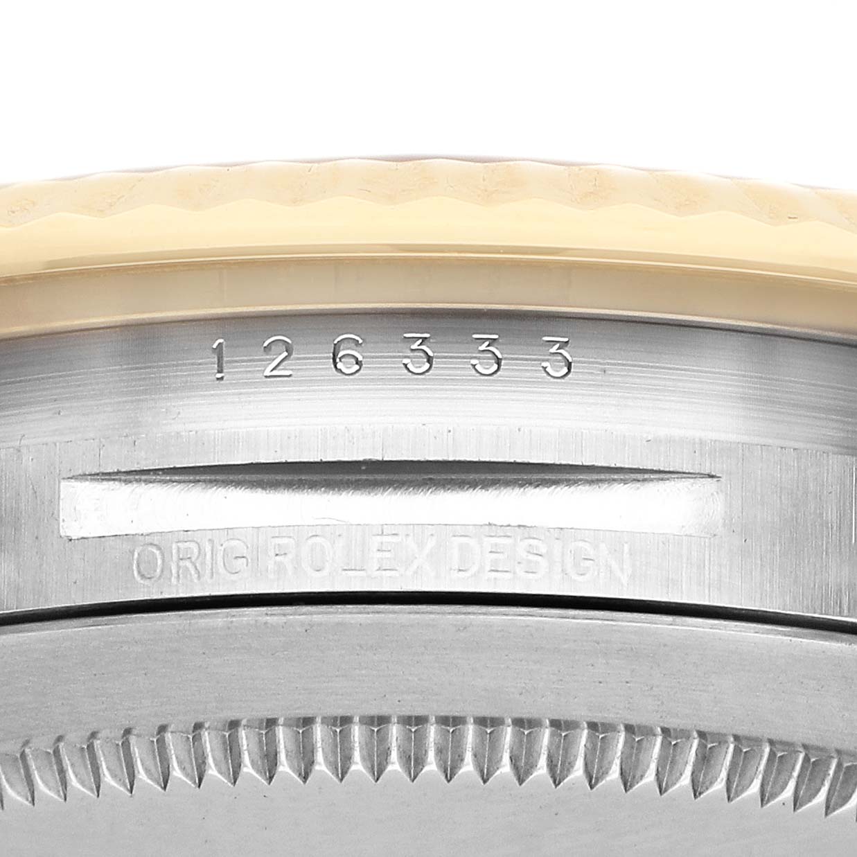The image shows a close-up of the Rolex Datejust 41 126333 Men's Steel and Gold (two tone) Silver Dial bezel and case side with model number and "ORIG ROLEX DESIGN" engraving.