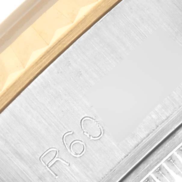 The image shows a close-up of the case edge and the fluted bezel of a Rolex Datejust 69173 Women's Steel and Gold (two tone) Beige Dial 69173 Women's Steel and Gold (two tone) Beige Dial.