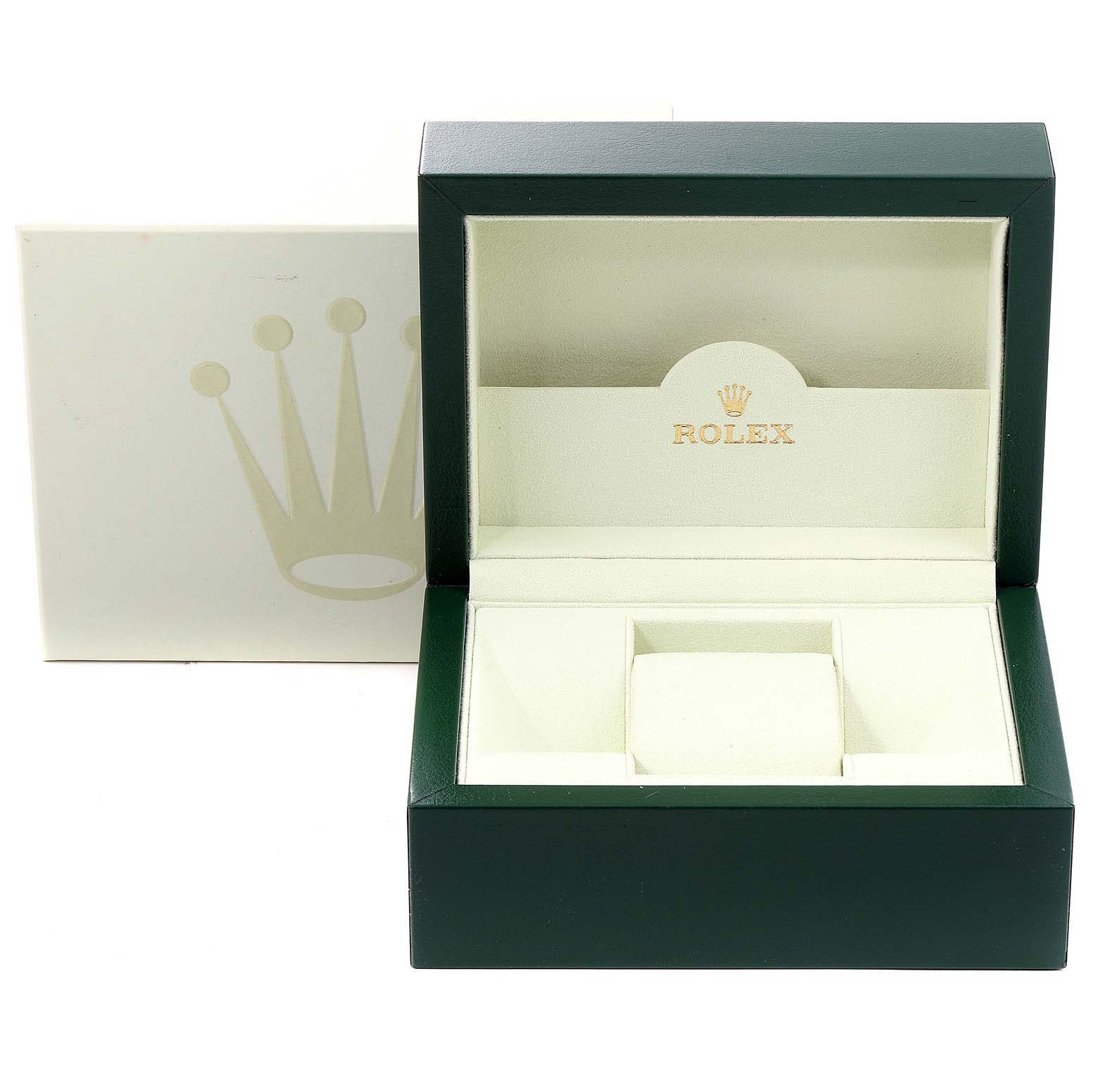 The image shows an open Rolex Mid-Size 178384 Women's Stainless Steel Grey Dial 178384 Women's Stainless Steel Grey Dial watch box with a green exterior and cream interior, featuring the Rolex logo.