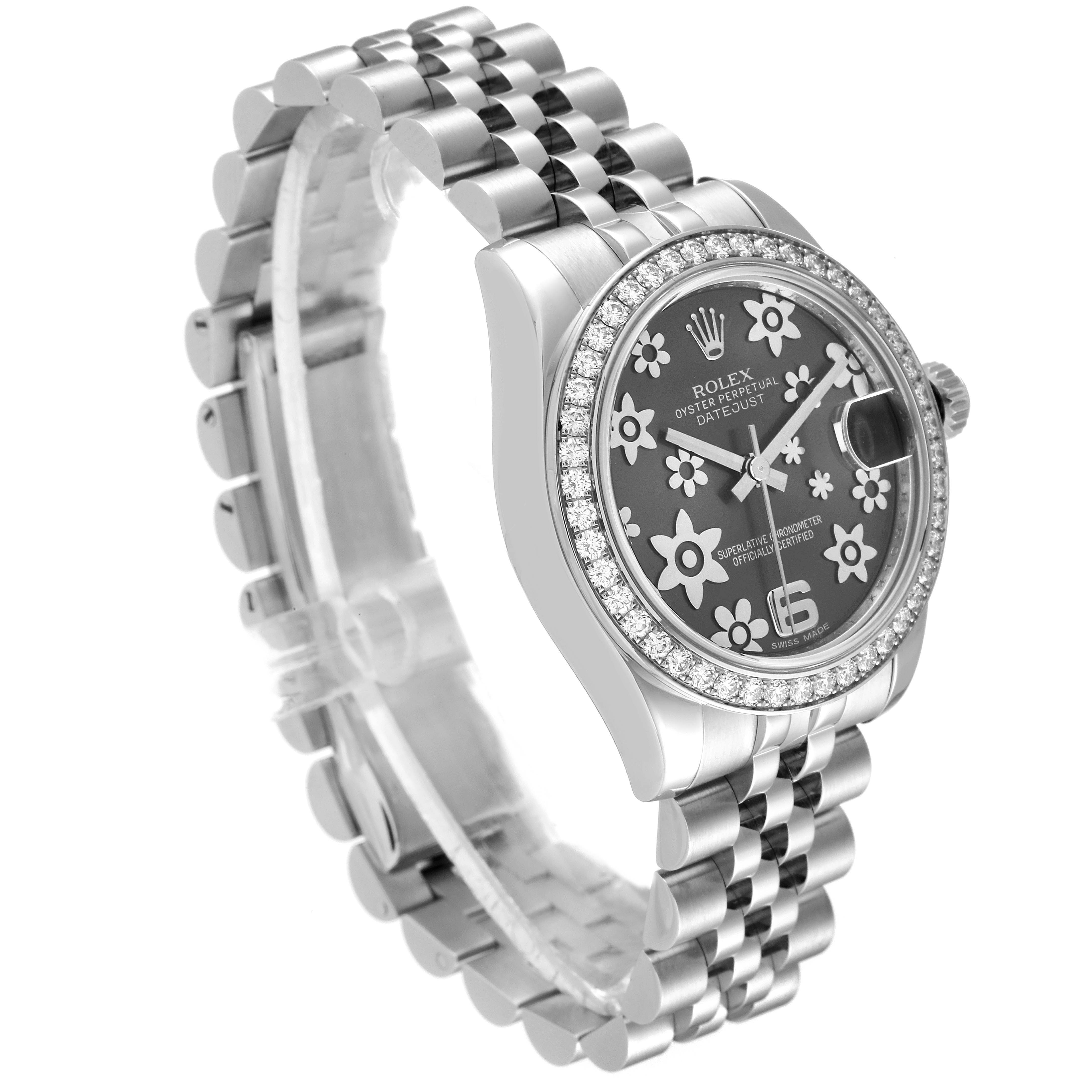 The image shows a side angle of a Rolex Mid-Size 178384 Women's Stainless Steel Grey Dial 178384 Women's Stainless Steel Grey Dial Datejust watch, featuring a floral-patterned dial and a Jubilee bracelet.