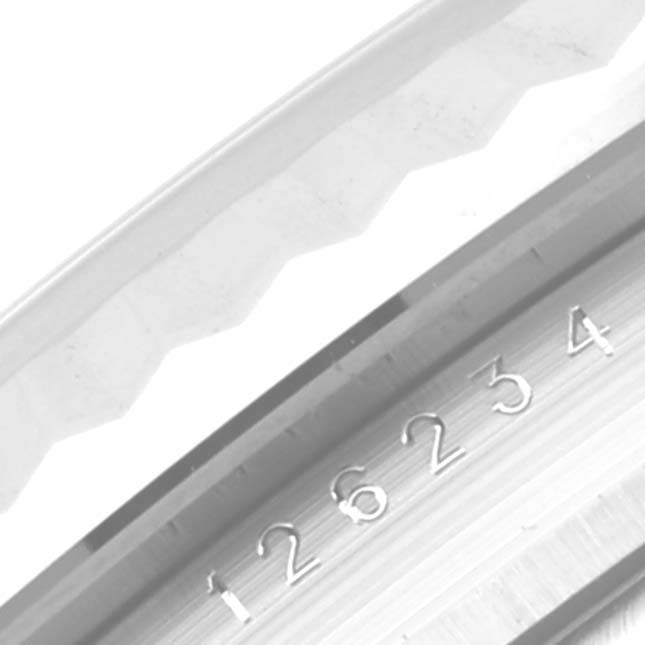 This is a close-up of the bezel and serial number on a Rolex Datejust 126234 Men's Stainless Steel White Dial 126234 Men's Stainless Steel White Dial watch.
