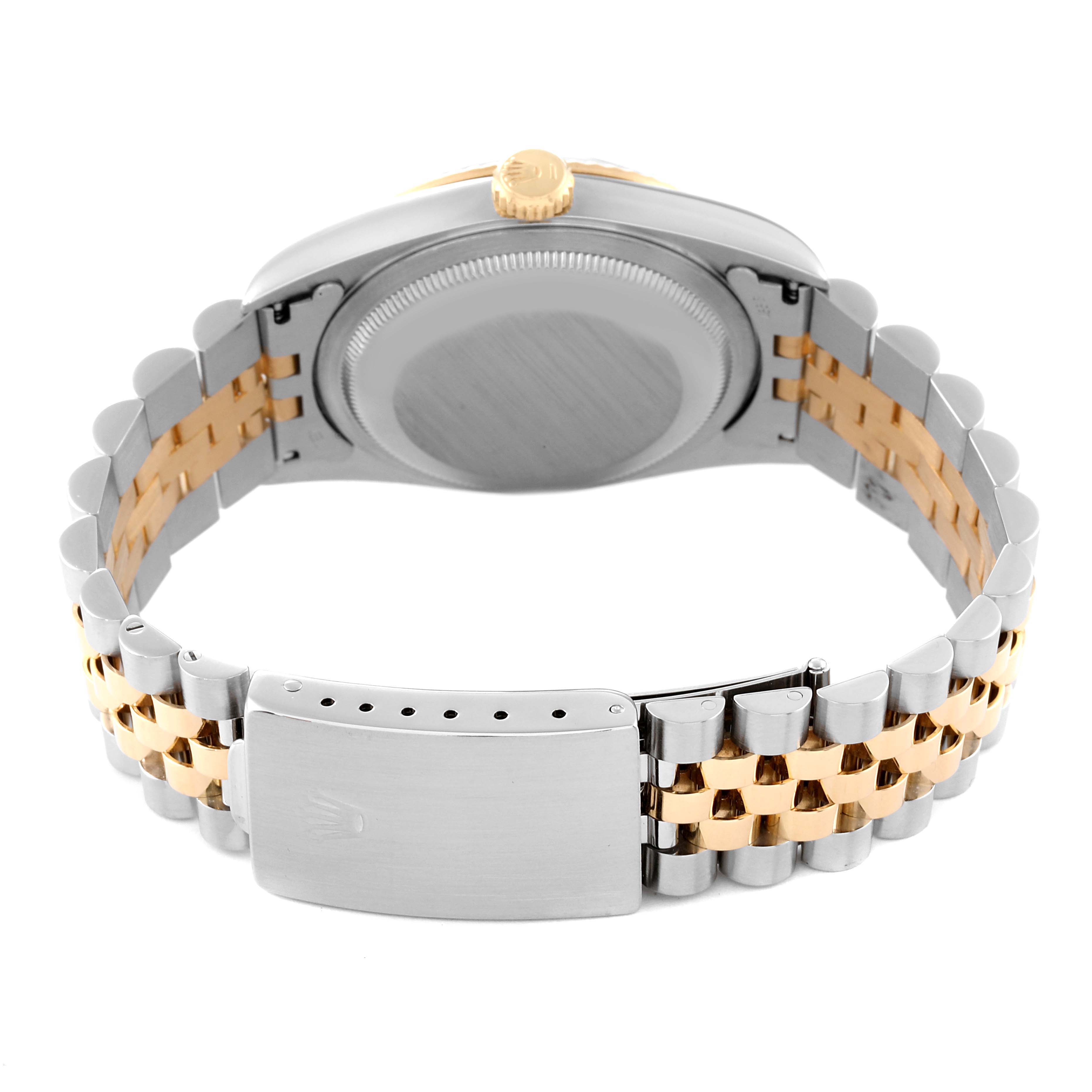 The image shows the back and bracelet of a Rolex Datejust 16233 Men's Steel and Gold (two tone) Blue Dial 16233 Men's Steel and Gold (two tone) Blue Dial watch, highlighting its two-tone metal links and clasp.