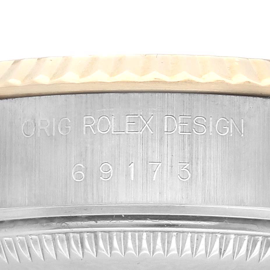 The image shows a side view of the Rolex Datejust 69173 Women's Steel and Gold (two tone) Champagne Dial 69173 Women's Steel and Gold (two tone) Champagne Dial bezel and case, highlighting the "Orig Rolex Design" engraving.