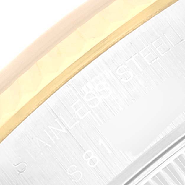 The image shows part of the watch case and edge of the bezel of a Rolex Datejust 69173 Women's Steel and Gold (two tone) Beige Dial 69173 Women's Steel and Gold (two tone) Beige Dial, highlighting the stainless steel and gold trim.