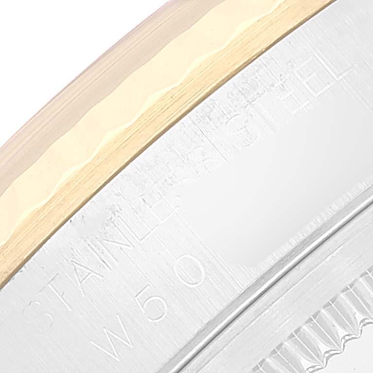 The image shows a close-up of the side of a Rolex Datejust 16233 Men's Steel and Gold (two tone) Beige Dial 16233 Men's Steel and Gold (two tone) Beige Dial watch case, highlighting the bezel and engraved markings.