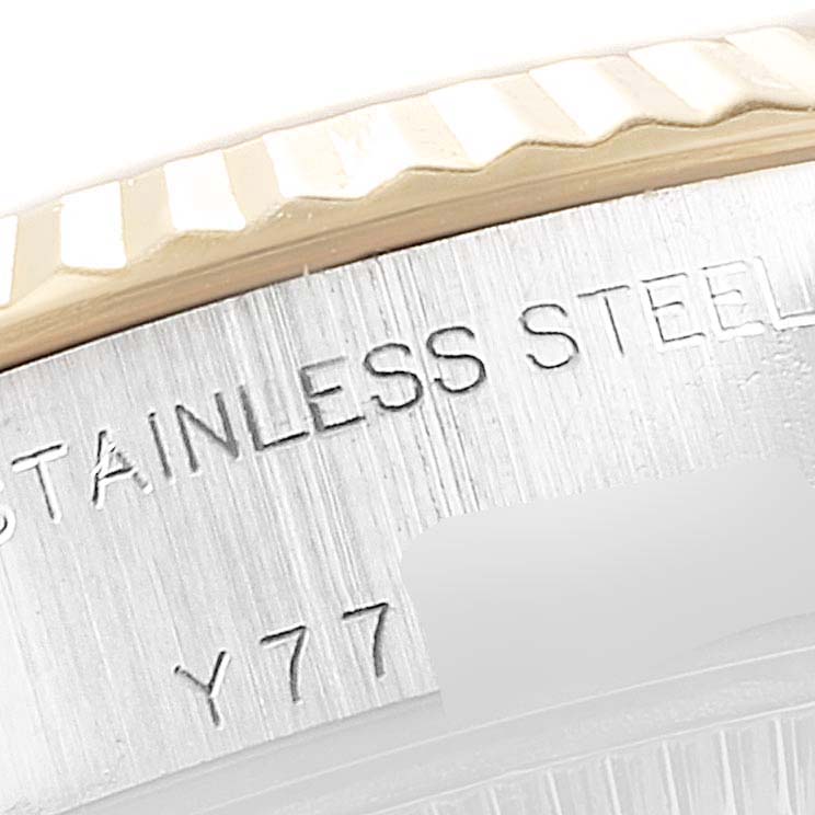 This close-up shows the fluted bezel and etched markings on the case of the Rolex Datejust 79173 Women's Steel and Gold (two tone) Silver Dial 79173 Women's Steel and Gold (two tone) Silver Dial watch.