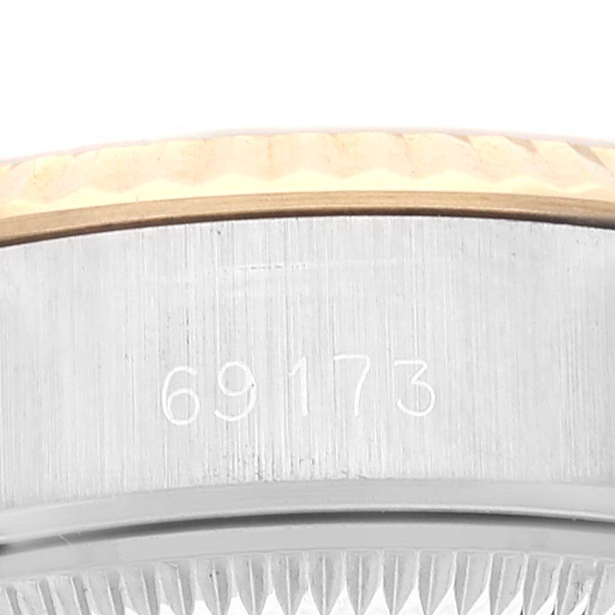 This is a close-up angle of the side of a Rolex Datejust 69173 Women's Steel and Gold (two tone) White Dial 69173 Women's Steel and Gold (two tone) White Dial watch case, showing the model number "69173."