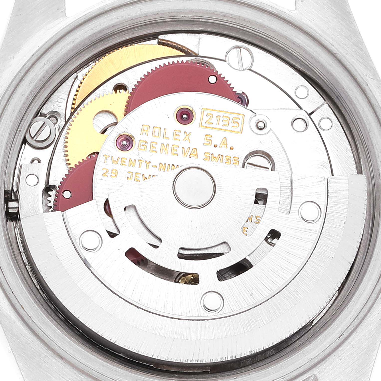 This image shows the internal mechanical movement components of a Rolex Datejust 69173 Women's Steel and Gold (two tone) White Dial 69173 Women's Steel and Gold (two tone) White Dial watch at an angle revealing gears and inscriptions.