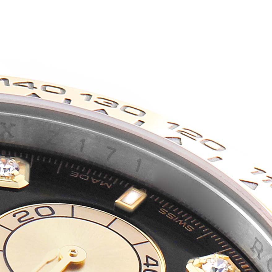 The image shows a close-up of the Rolex Daytona 126503 Men's Steel and Gold (two tone) Black Dial watch's bezel and part of the dial, highlighting markers and numbers.