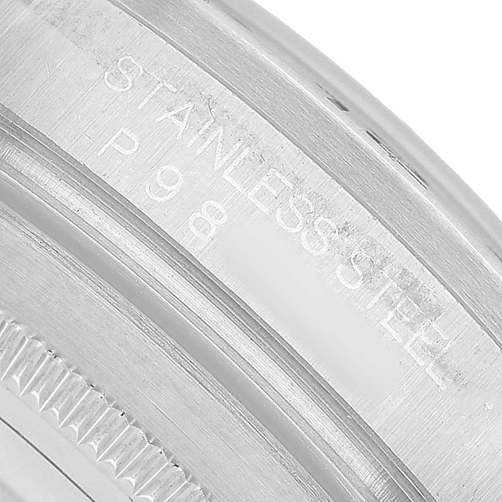 The image shows the engraved side of the case of a Rolex Explorer 16570 Men's Stainless Steel White Dial, focusing on the stainless steel marking.