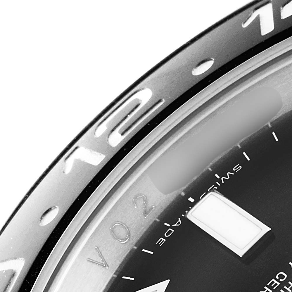 The image shows a close-up of the bezel and part of the dial of a Rolex GMT-Master 116710 Men
s Stainless Steel Black Dial 116710 Men
s Stainless Steel Black Dial watch.