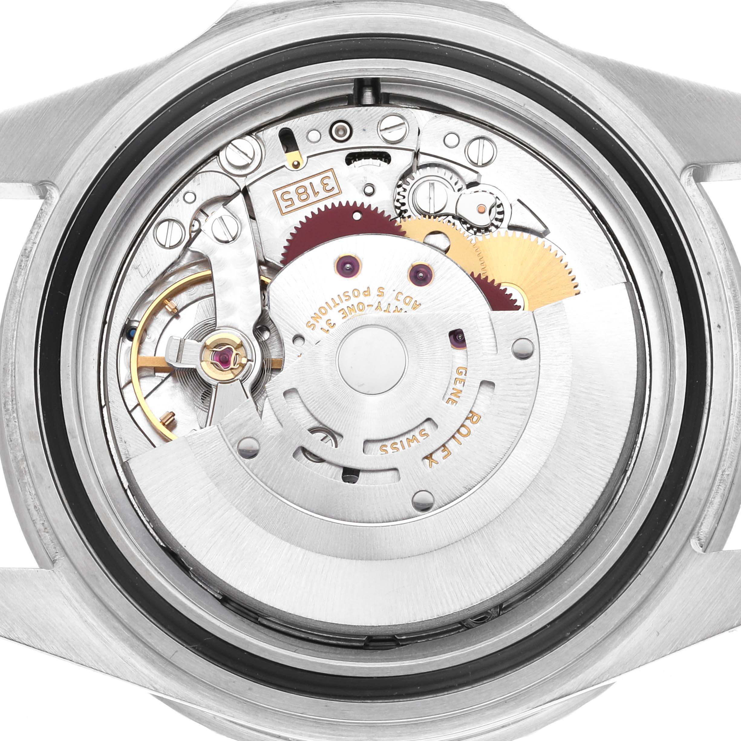 The image shows the open case back view of a Rolex GMT-Master 16710 Men's Stainless Steel Black Dial 16710 Men's Stainless Steel Black Dial, displaying its movement components and intricate mechanics.