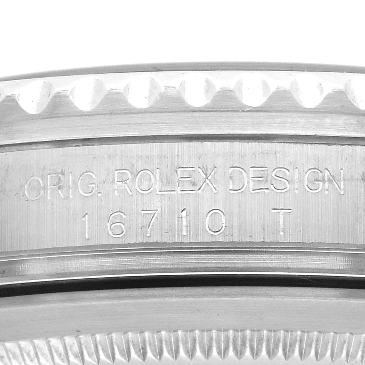 The image shows a side view of the Rolex GMT-Master 16710 Men's Stainless Steel Black Dial 16710 Men's Stainless Steel Black Dial case, focusing on the engraved model and design text.